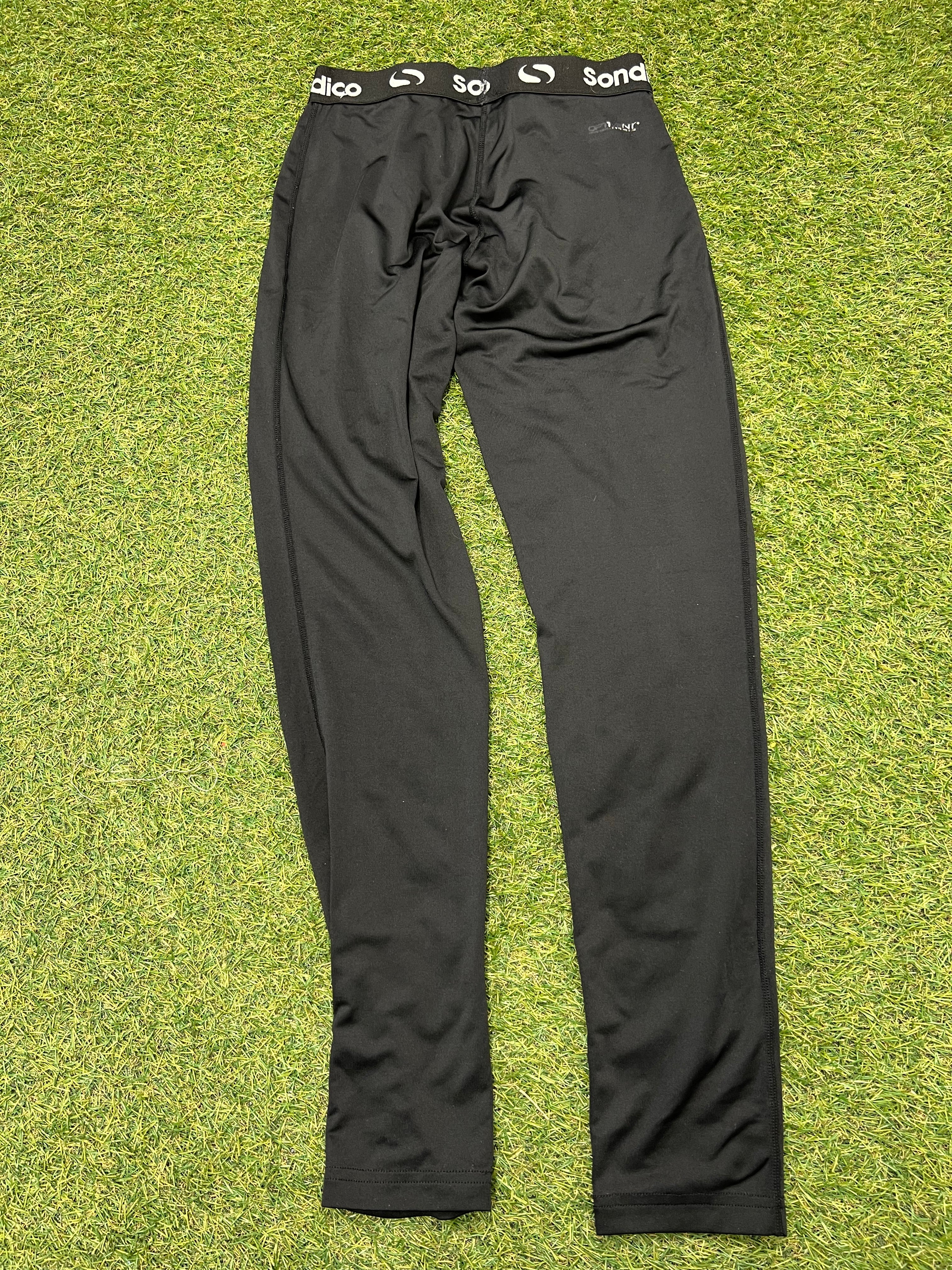 Back view of black Sondico kids base layer leggings showing smooth fabric and stitching