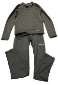 Sondico black kids base layer top and leggings laid flat on green artificial grass.