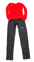 Sondico kids base layer set with red long-sleeve top and navy leggings displayed on grass