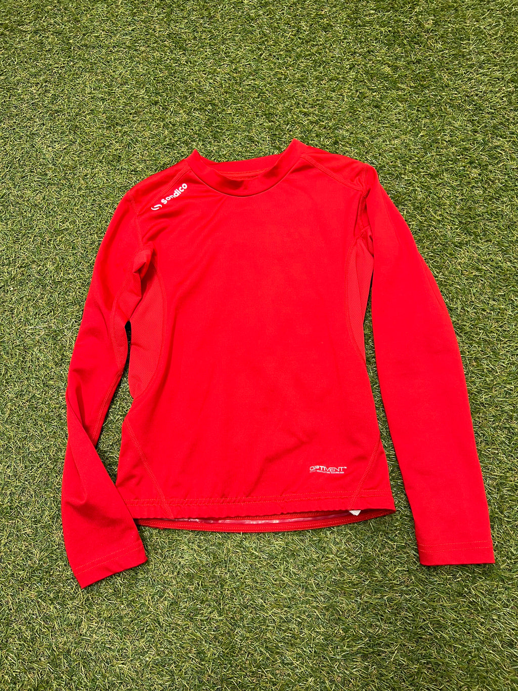 Red Sondico long sleeve base layer top back view showing logo and ventilation panel