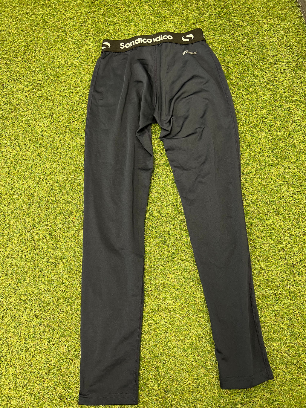 Close-up of Sondico branded elastic waistband and size label on black leggings for kids aged 11-12 years