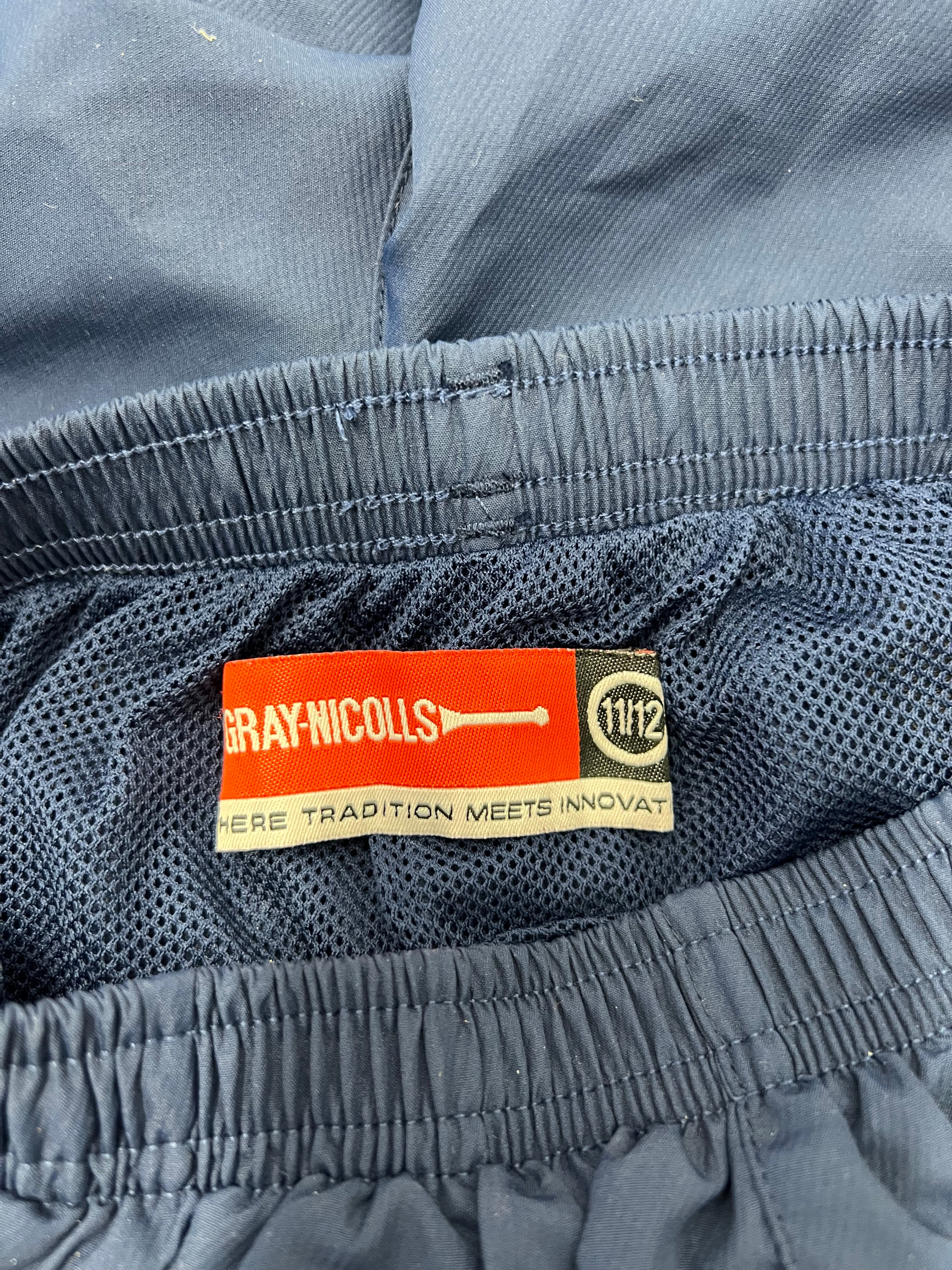 Close-up inside label of Gray Nicolls shorts in size 11/12 displaying lightweight inner mesh lining