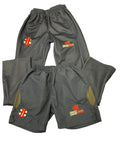 Gray-Nicolls navy youth tracksuit bottoms and shorts with Cricket Wales logo side by side on artificial grass