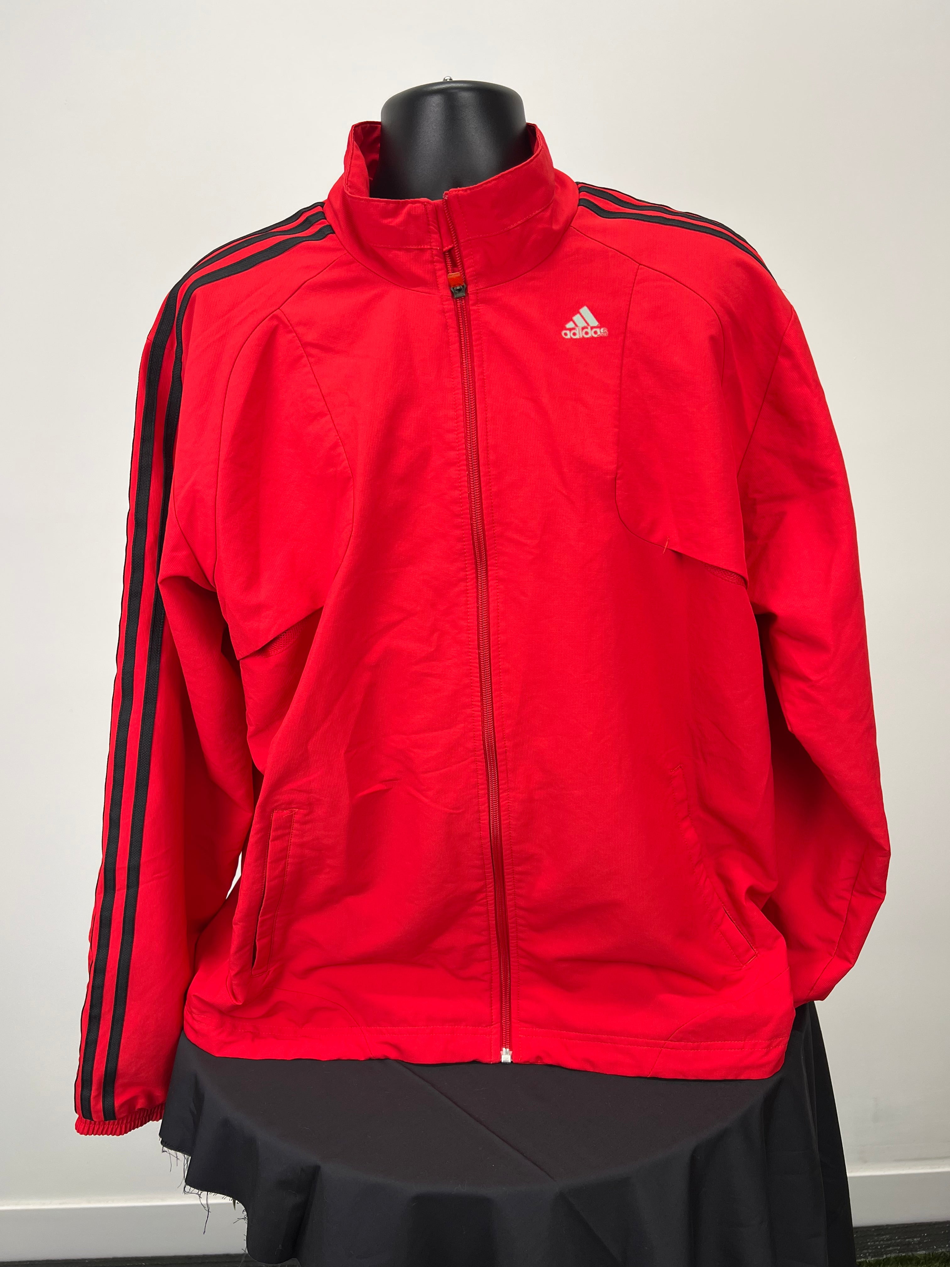 Front view of Adidas men's lightweight red full zip jacket with black stripes on sleeves and zip pockets