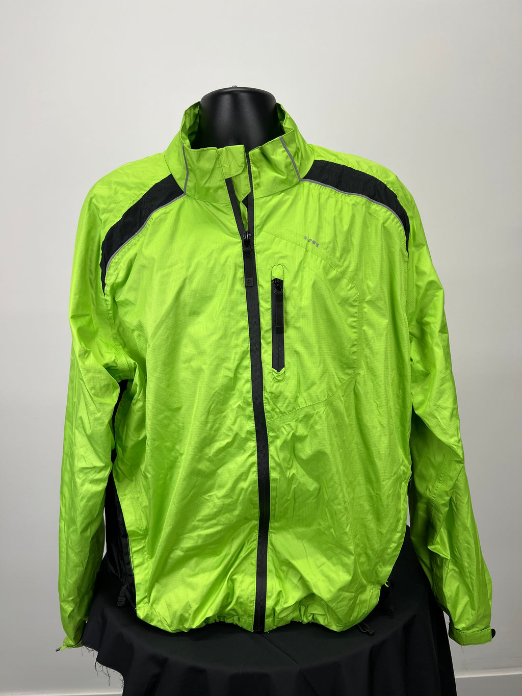 Front view of neon green Muddyfox cycling jacket with full zip and chest pocket on mannequin