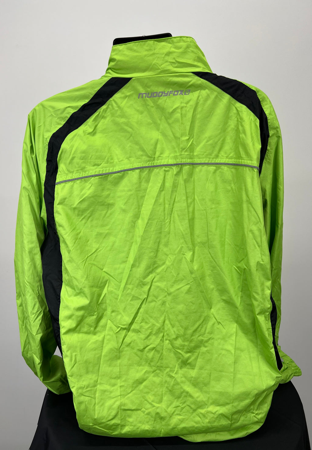 Back view of neon green Muddyfox cycling jacket with black side panels and reflective strip across shoulders