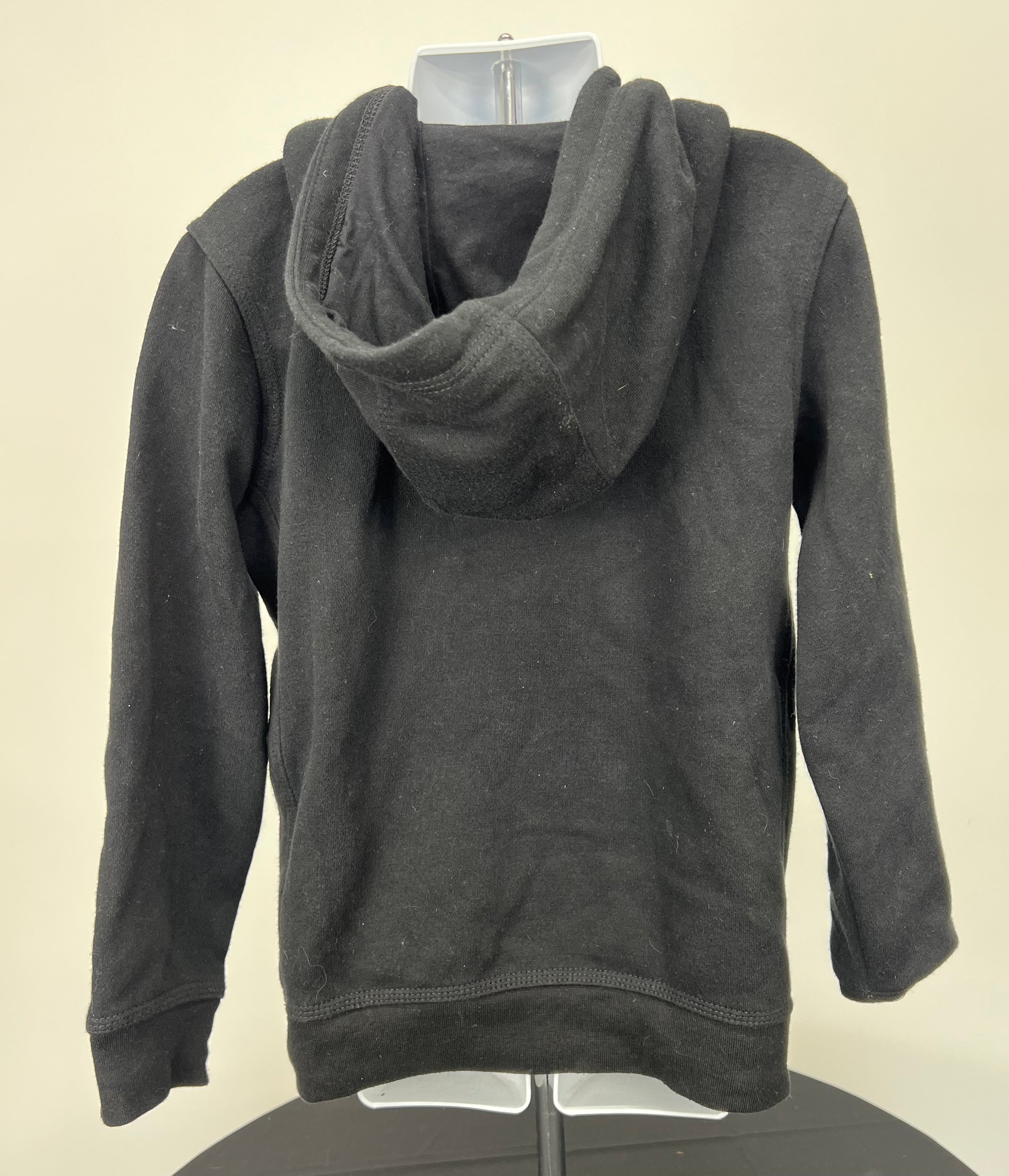 Back view of black Nike kids' hoodie showing the hood and plain design