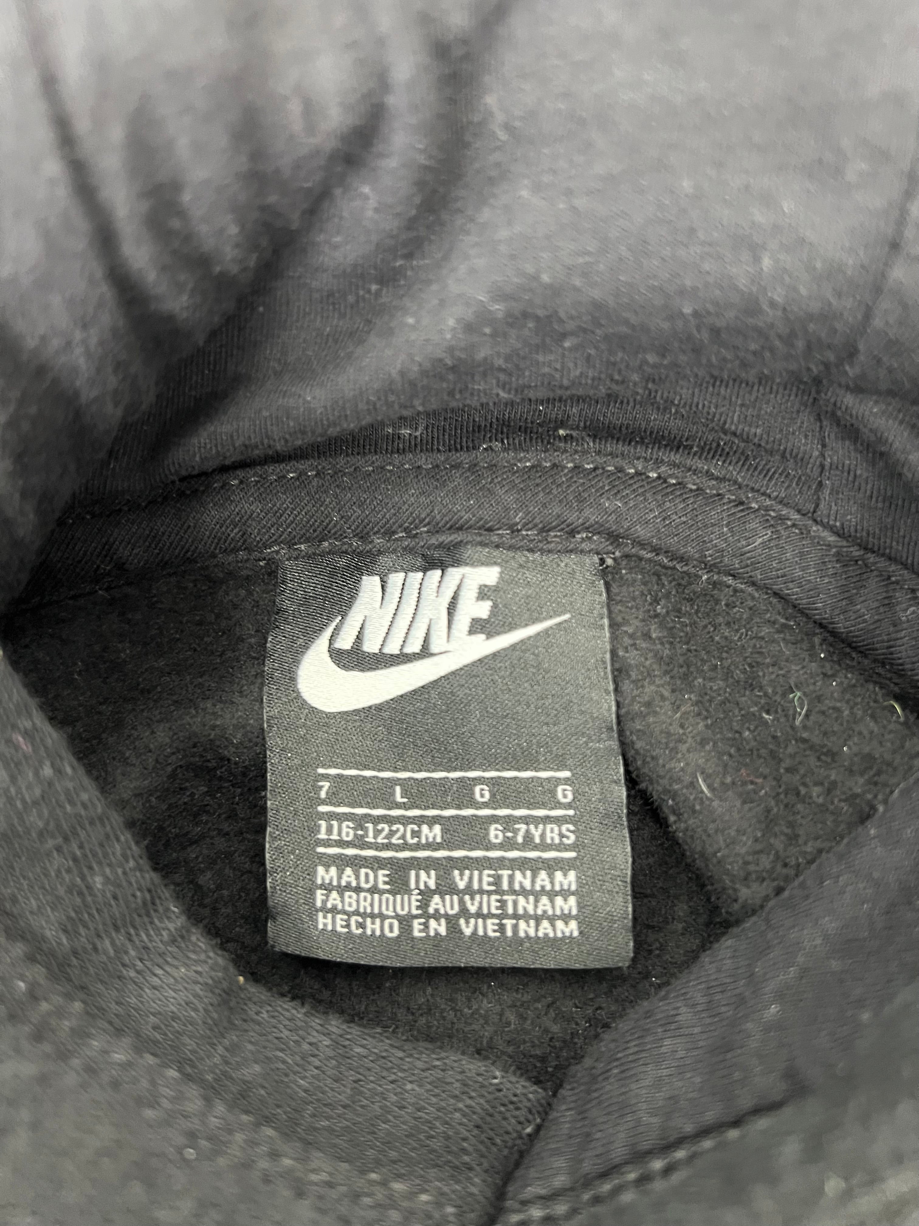 Close-up of the Nike kids' hoodie label showing size 6-7 years and made in Vietnam