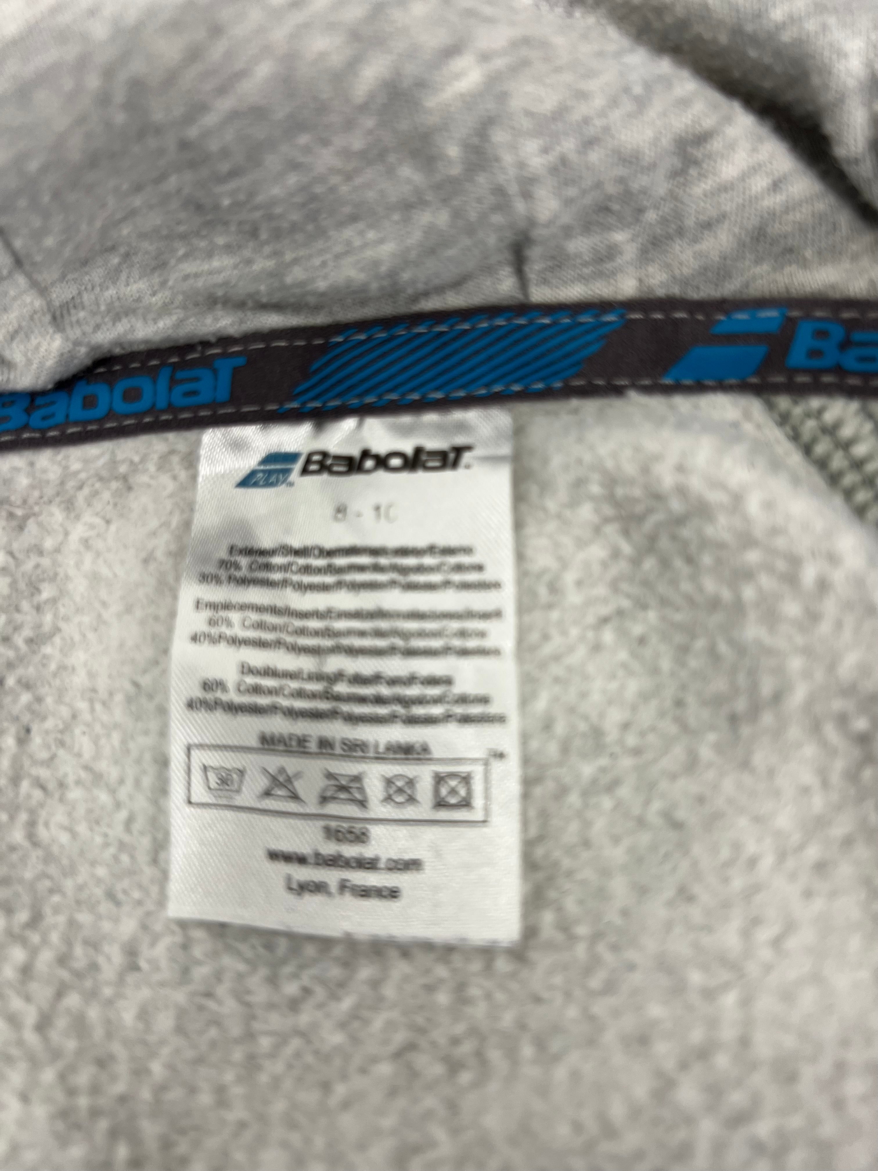 Inner label detailing material composition and care instructions on kids Babolat grey hoodie