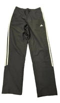 Front view of adidas black tracksuit bottoms with white side stripes