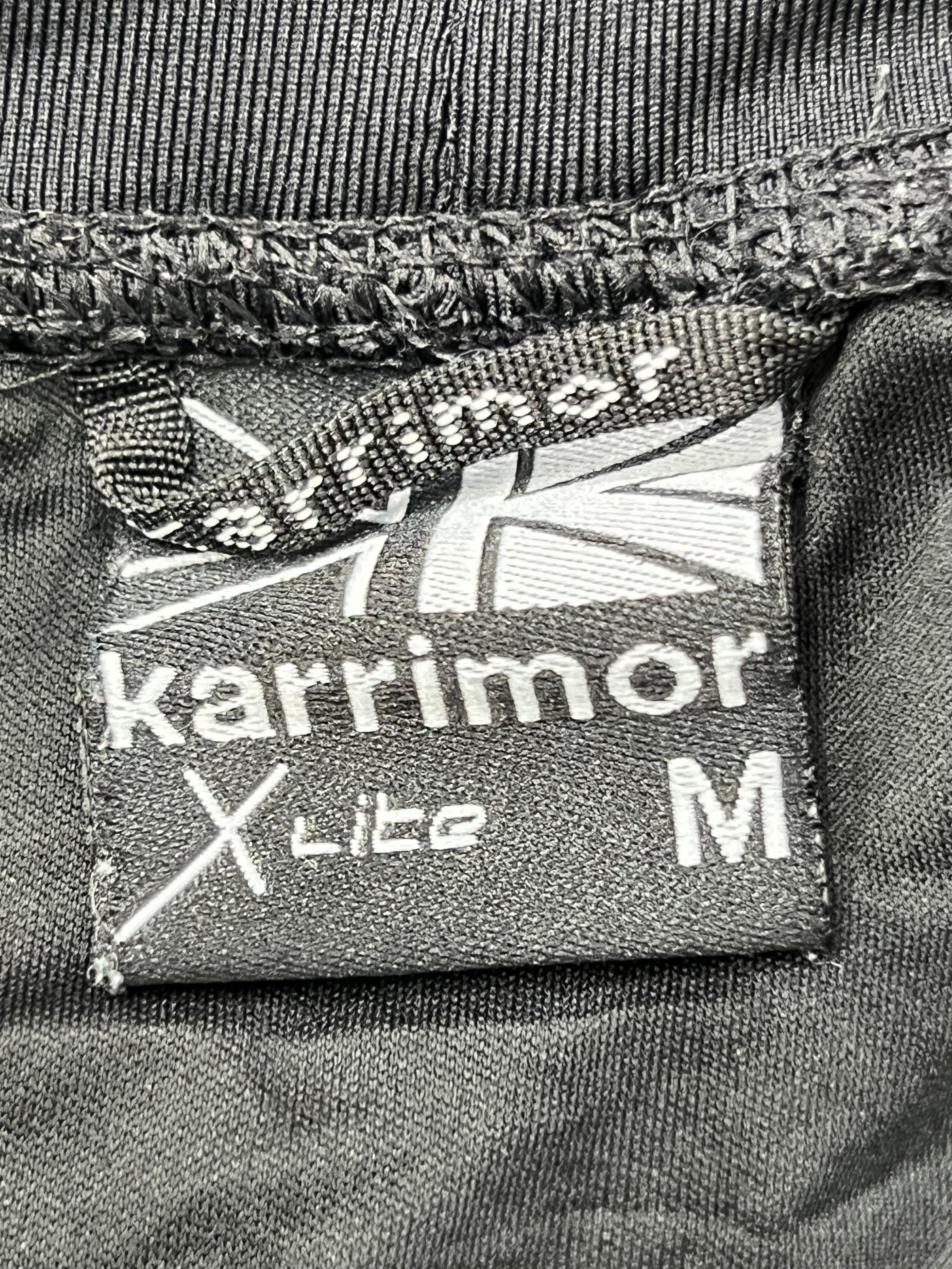 Close-up of Karrimor X Lite label inside the waistband of black running tights