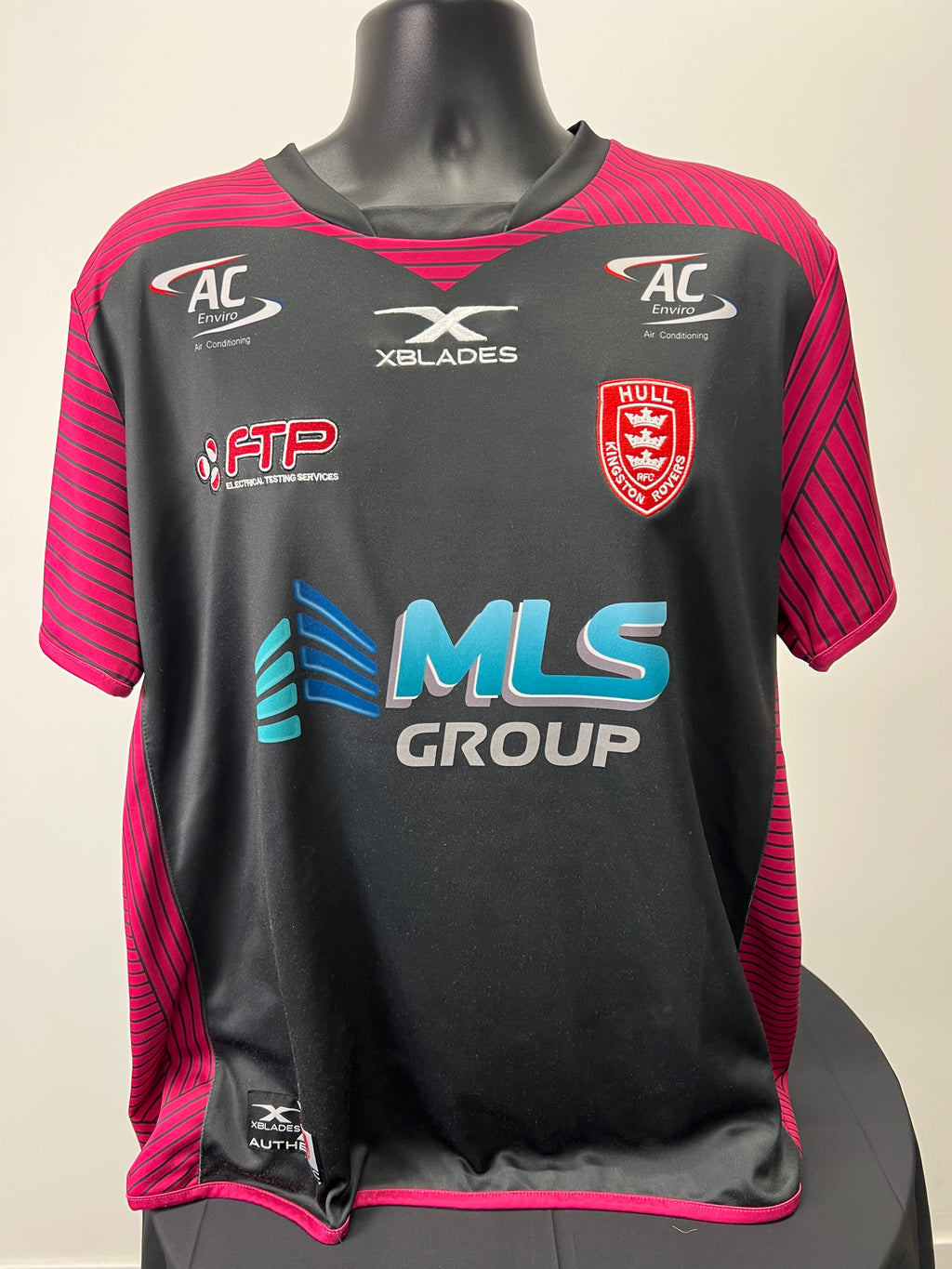 Front view of Hull Kingston Rovers men's rugby jersey in black and magenta with team and sponsor logos