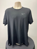 Front view of a black Nike Dri-FIT t-shirt on a mannequin with a subtle reflective Nike logo on the chest