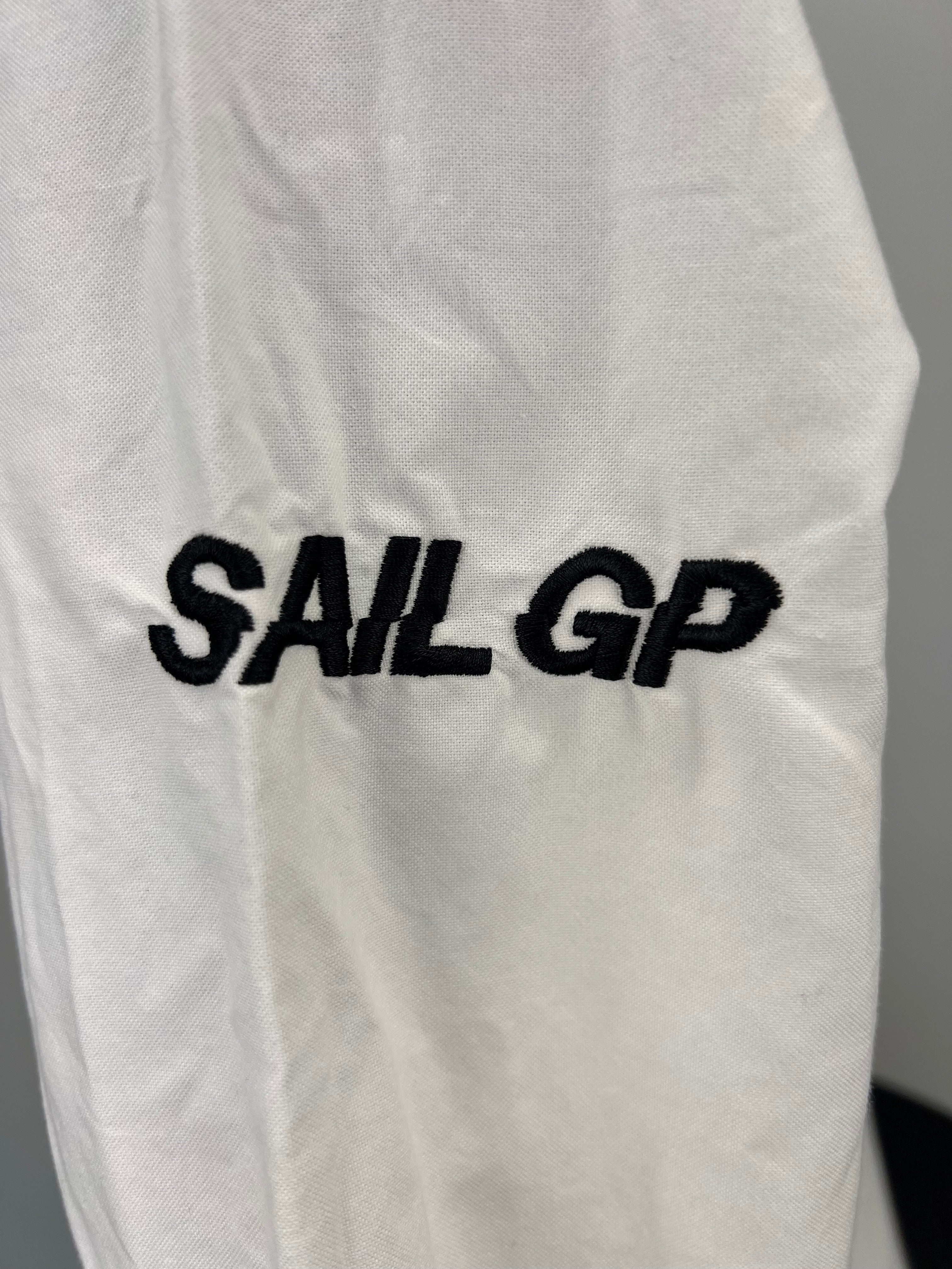 Close-up of Sail GP embroidery on sleeve of white shirt
