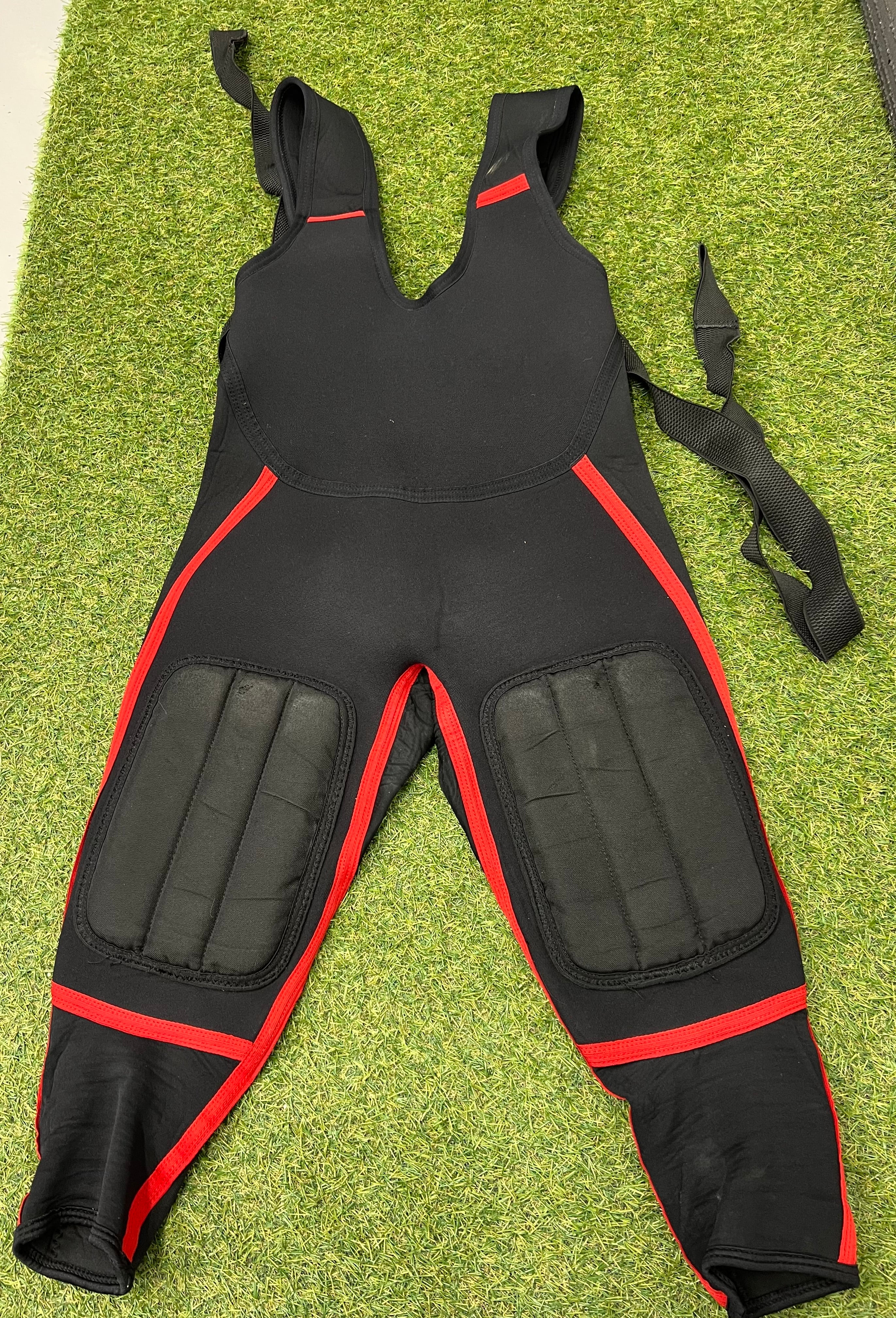 Rear view of Rooster sailing neoprene bib trousers showing padded knee panels and red accents