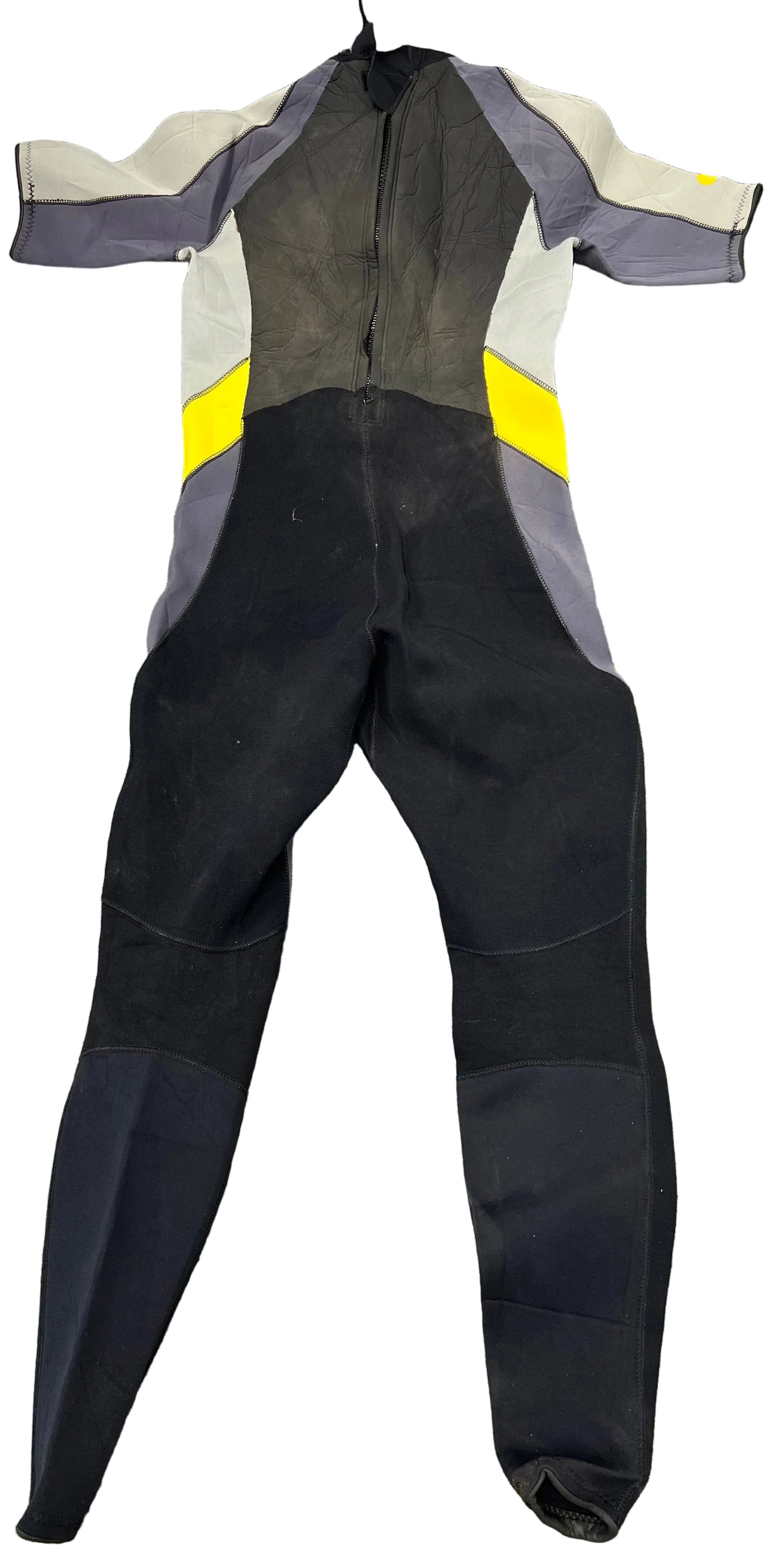 Gill short arm wetsuit laid flat showing front side with black, grey, beige and yellow colour panels on grass