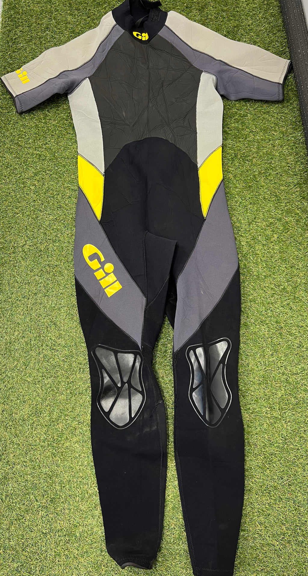 Back view of Gill short arm wetsuit showing reinforced knee pads and grey, black and yellow design