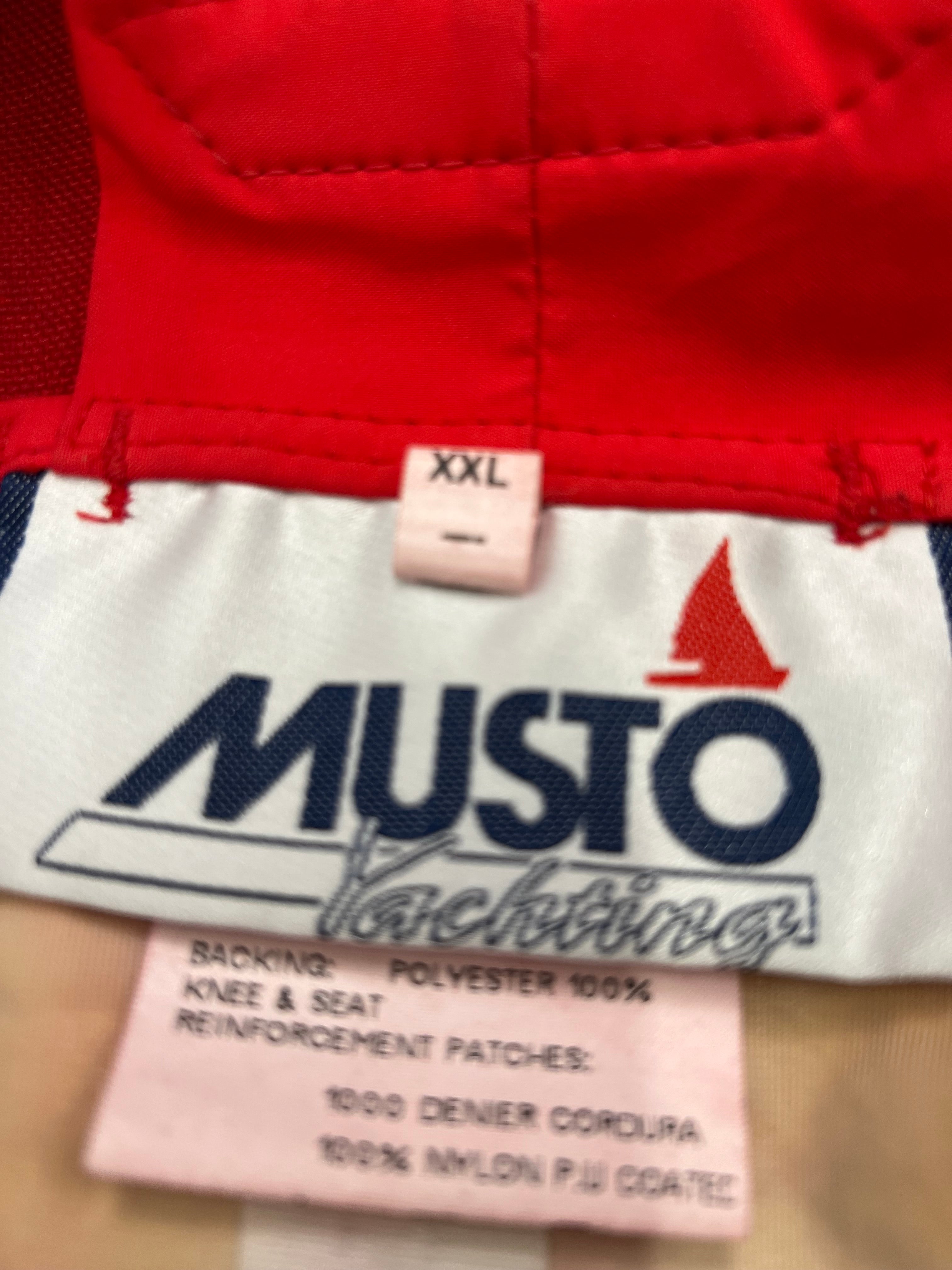 Label inside Musto trousers showing size XXL and fabric composition including polyester and Cordura nylon.