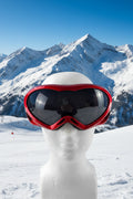 Red ski goggles with tinted black lens 