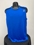 Front view of men's Reebok sleeveless athletic top in vibrant blue with black shoulder accents on display mannequin