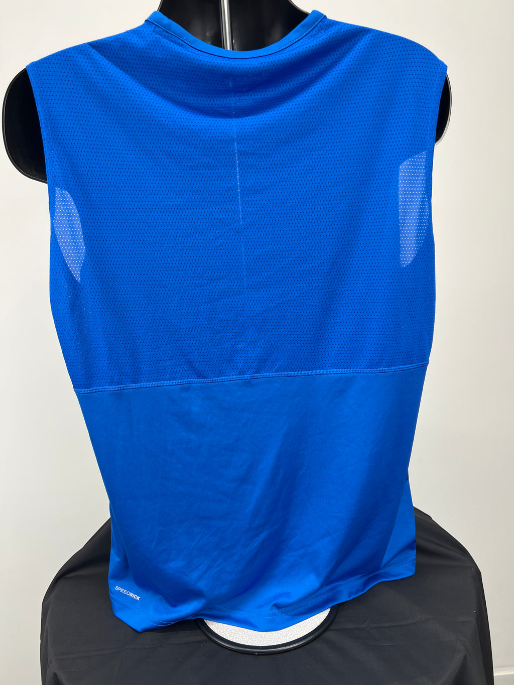Back view of men's Reebok sleeveless top showing blue ventilated mesh panel and Speedwick branding