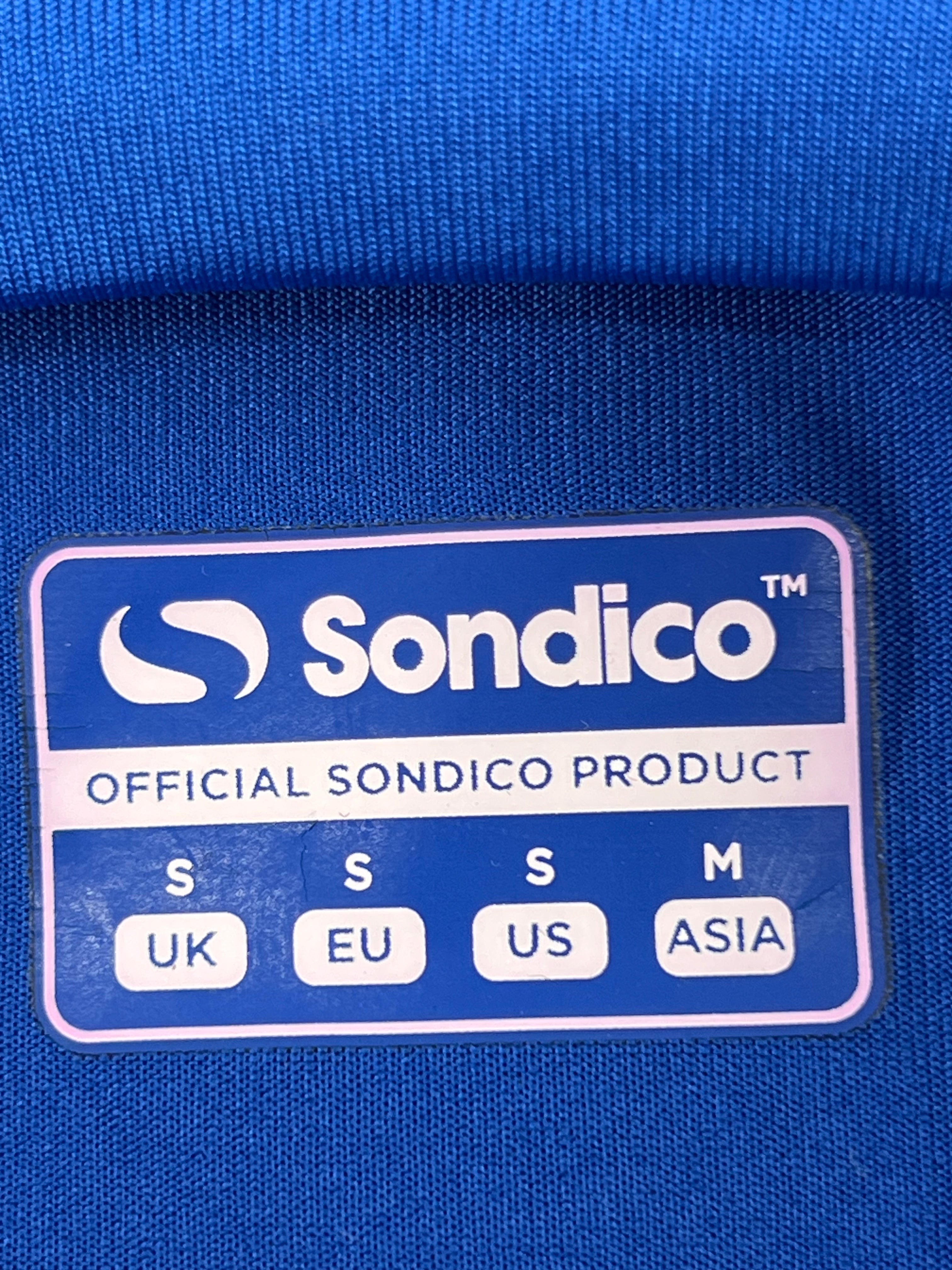 Close-up of Sondico sizing label indicating official product and size S for UK, EU, US