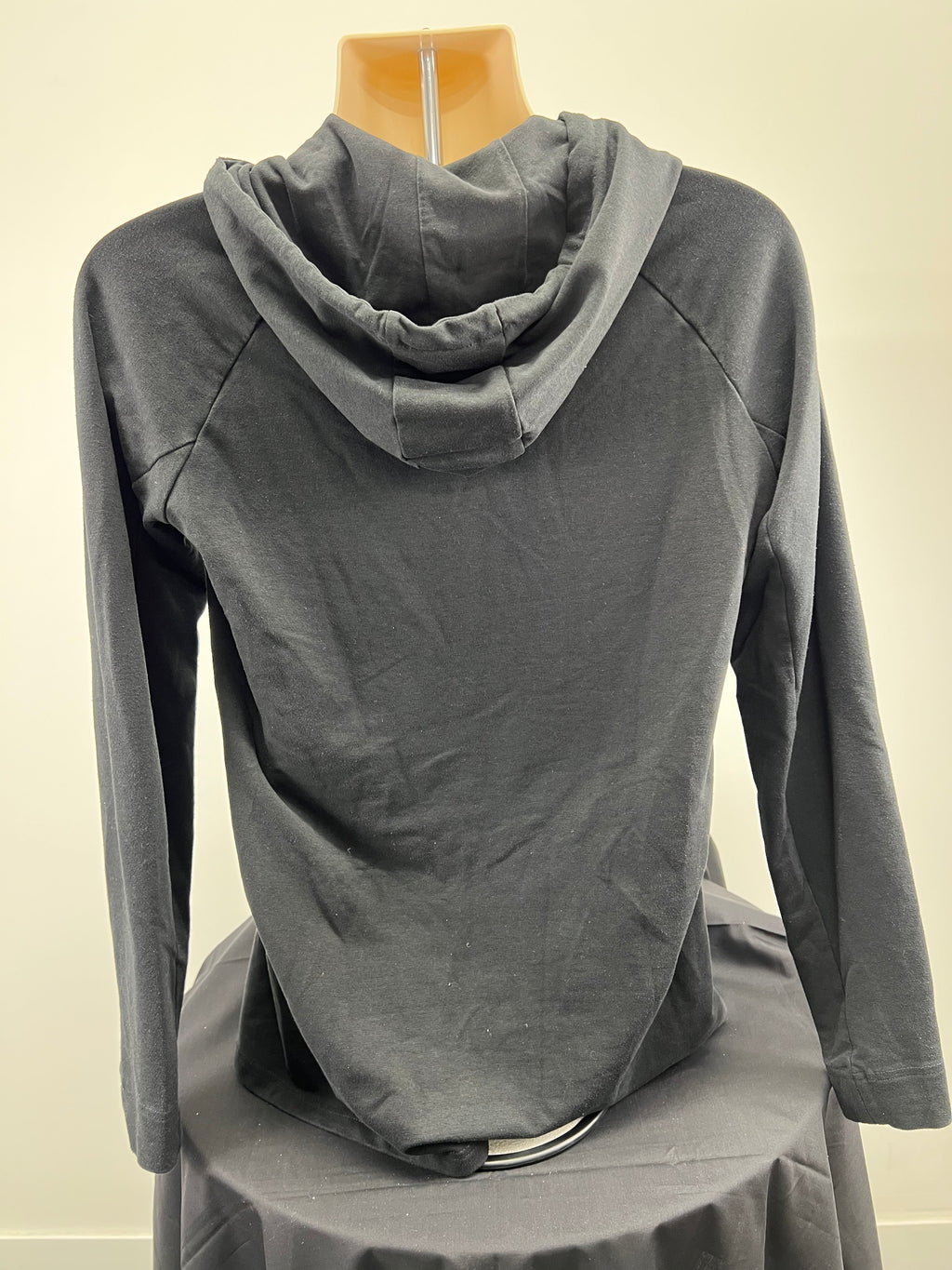 Back view of a men’s black Gymshark hoodie showing clean design and hood details