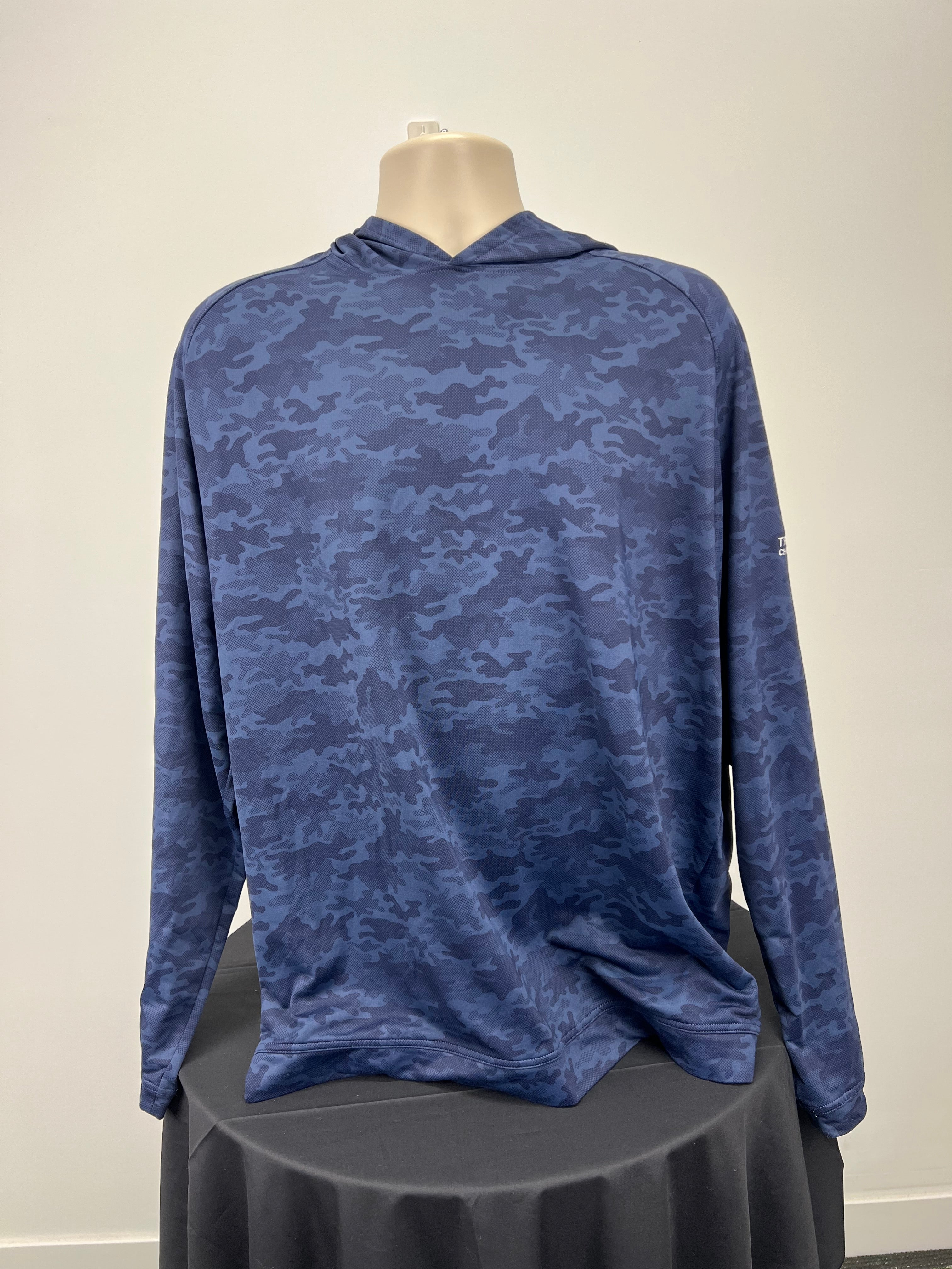 Front view of blue camo print hoodie with long sleeves on mannequin