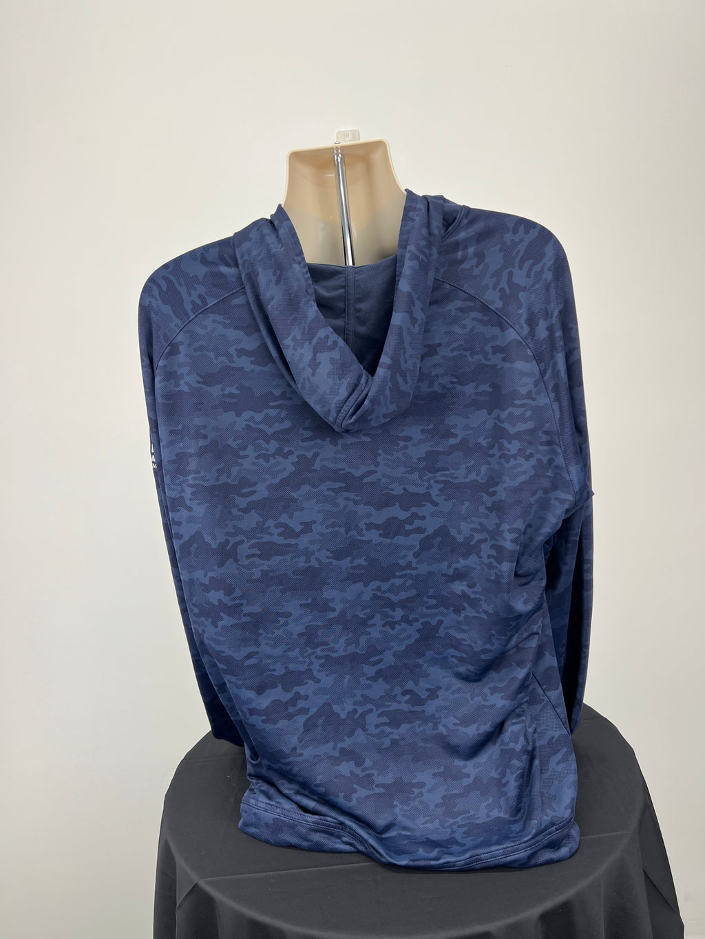 Back view of blue camo hoodie showing hood and full coverage