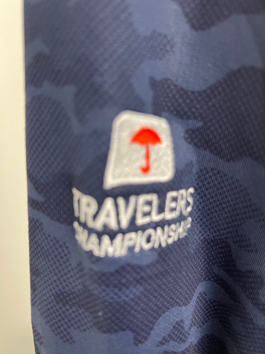 Close-up of embroidered Travelers Championship logo on hoodie sleeve