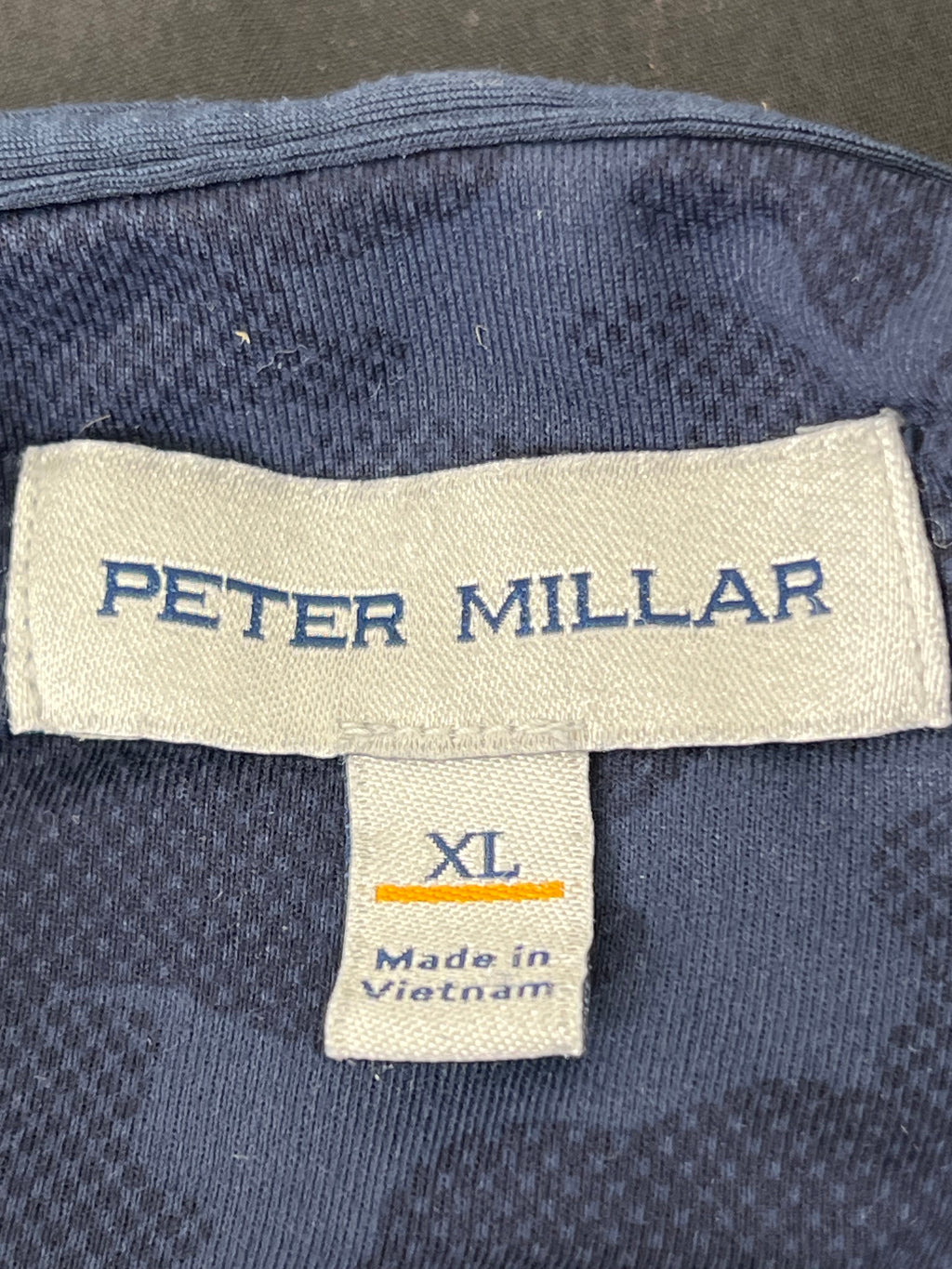 Label inside hoodie showing Peter Millar brand name and XL size tag