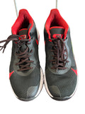 Pair of Nike Renew Elevate black and red trainers shown from above on display
