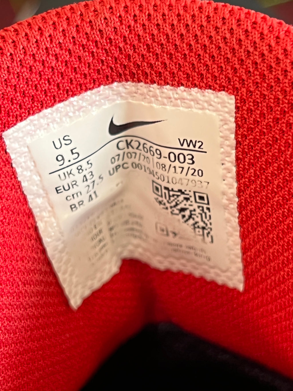 Close-up of shoe size label inside Nike Renew Elevate trainers showing size US 9.5 and product code