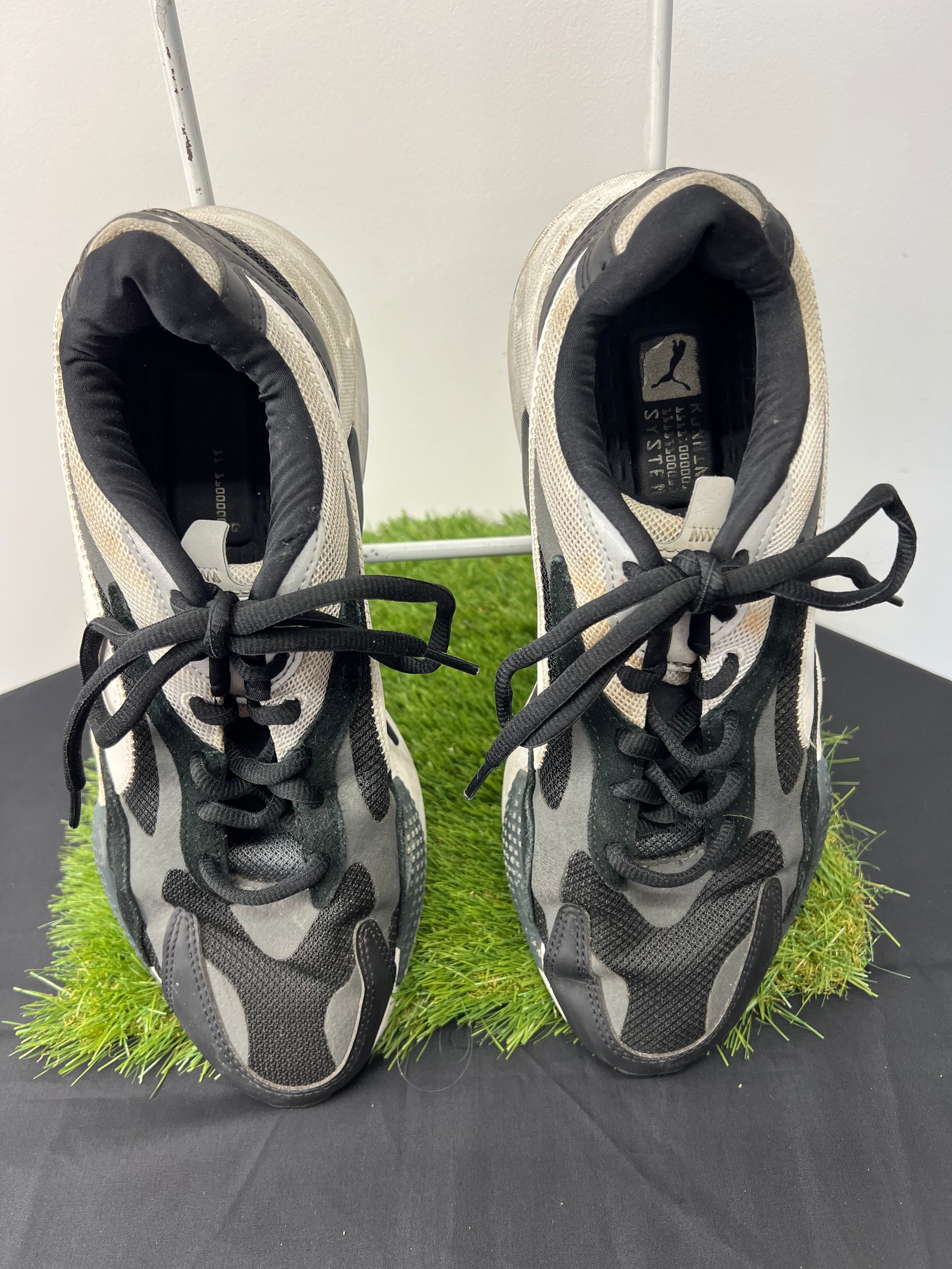 Front view of Puma RS-X trainers in black, white and grey with laces tied