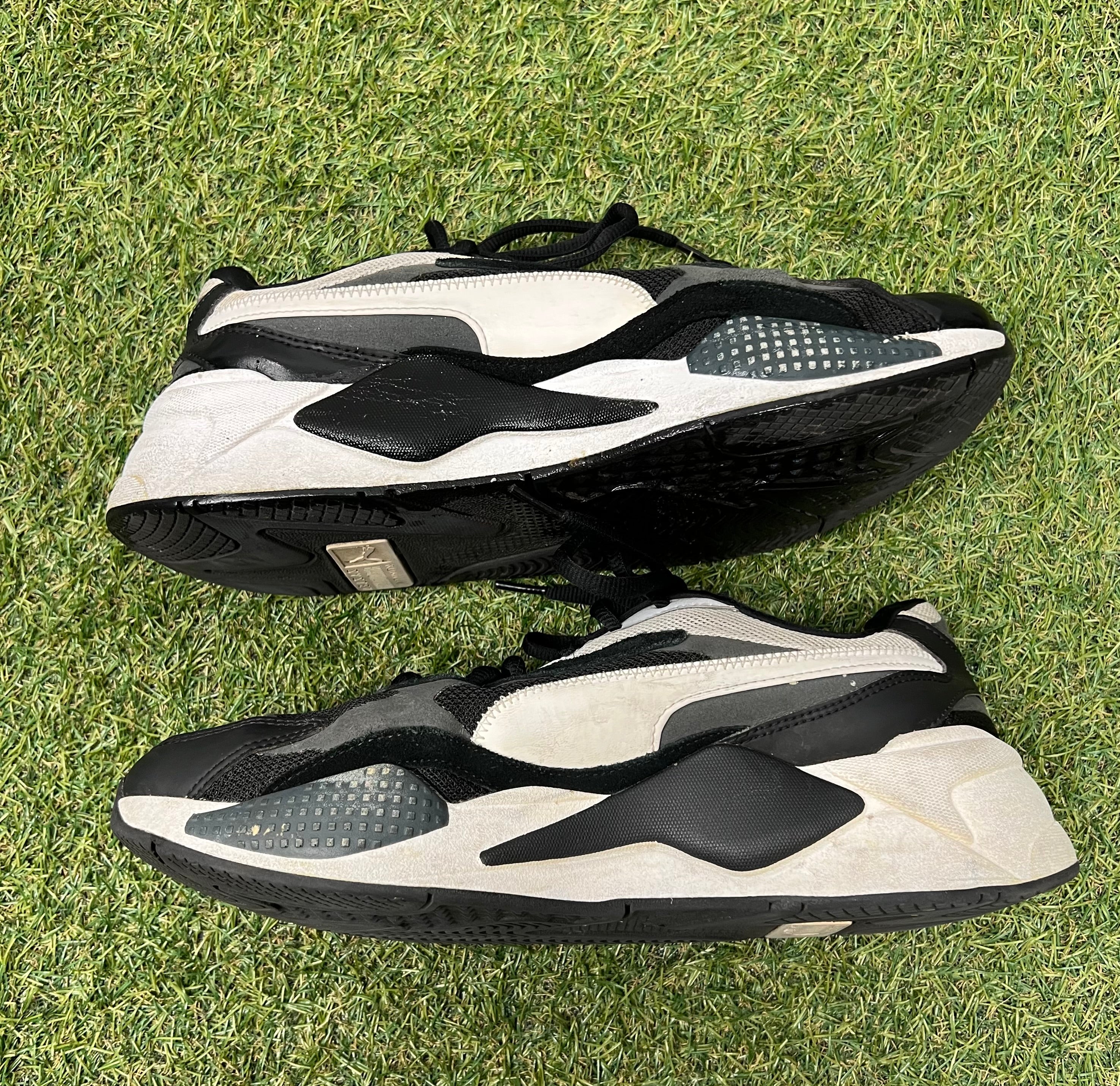 Alternate side view of Puma RS-X trainers emphasizing design details and sole construction