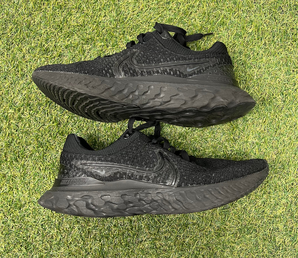 Opposite side view of Nike React trainer showcasing sleek black design and Nike logo