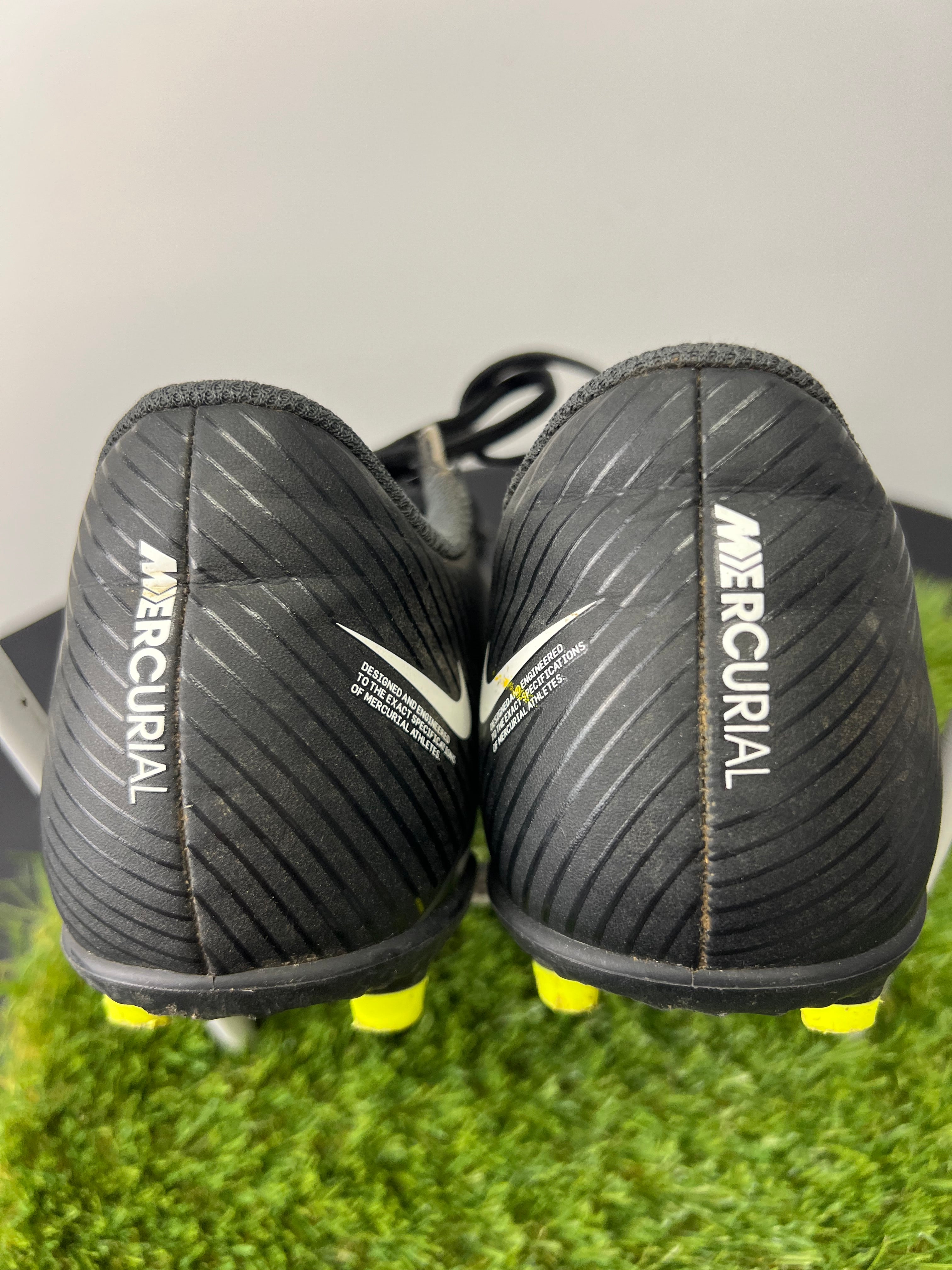 Rear view of black Nike Mercurial football boots with white Nike logo and Mercurial branding