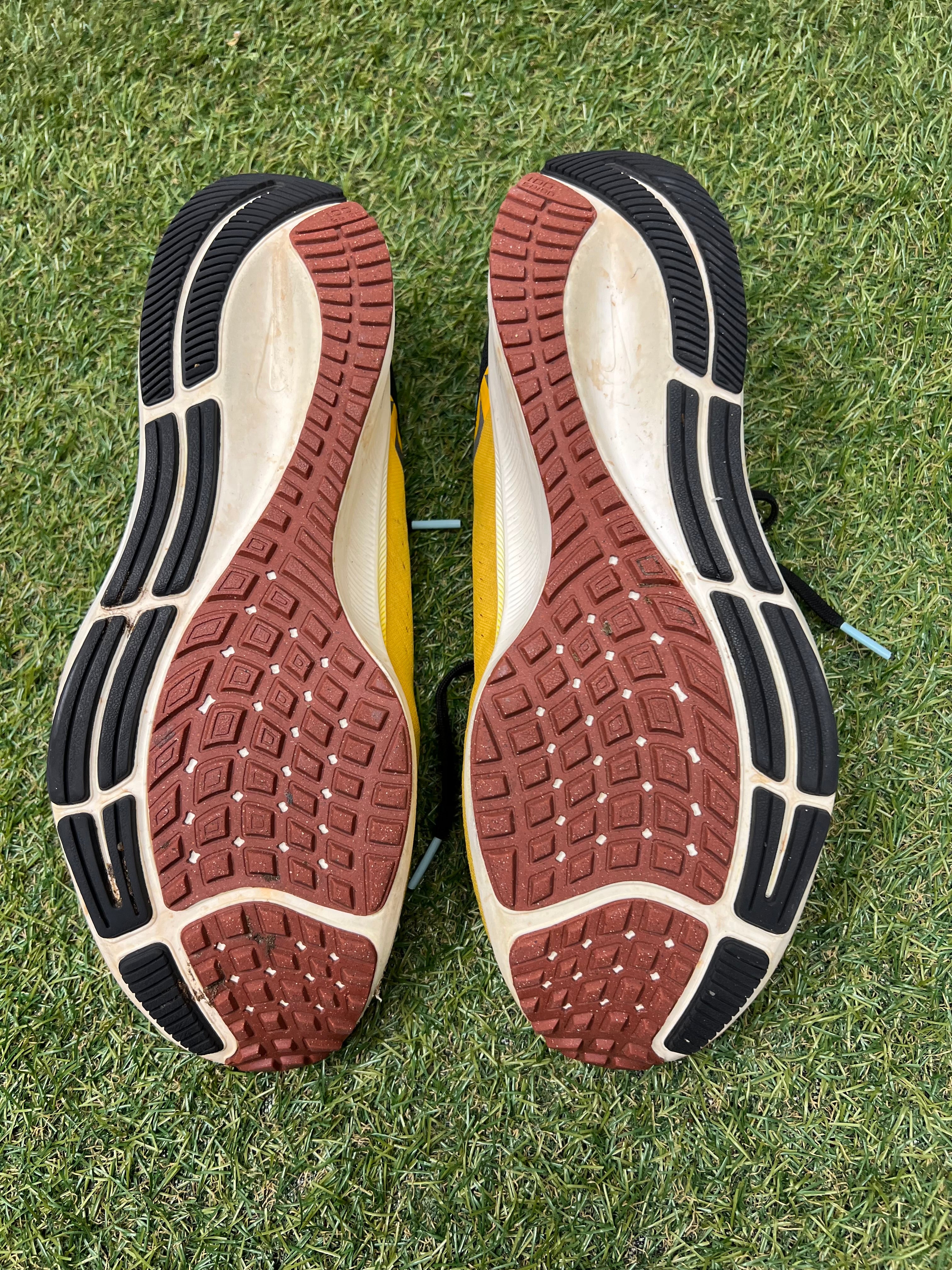 Soles of Nike Air Zoom Pegasus 38 showing durable rubber with tread pattern for traction
