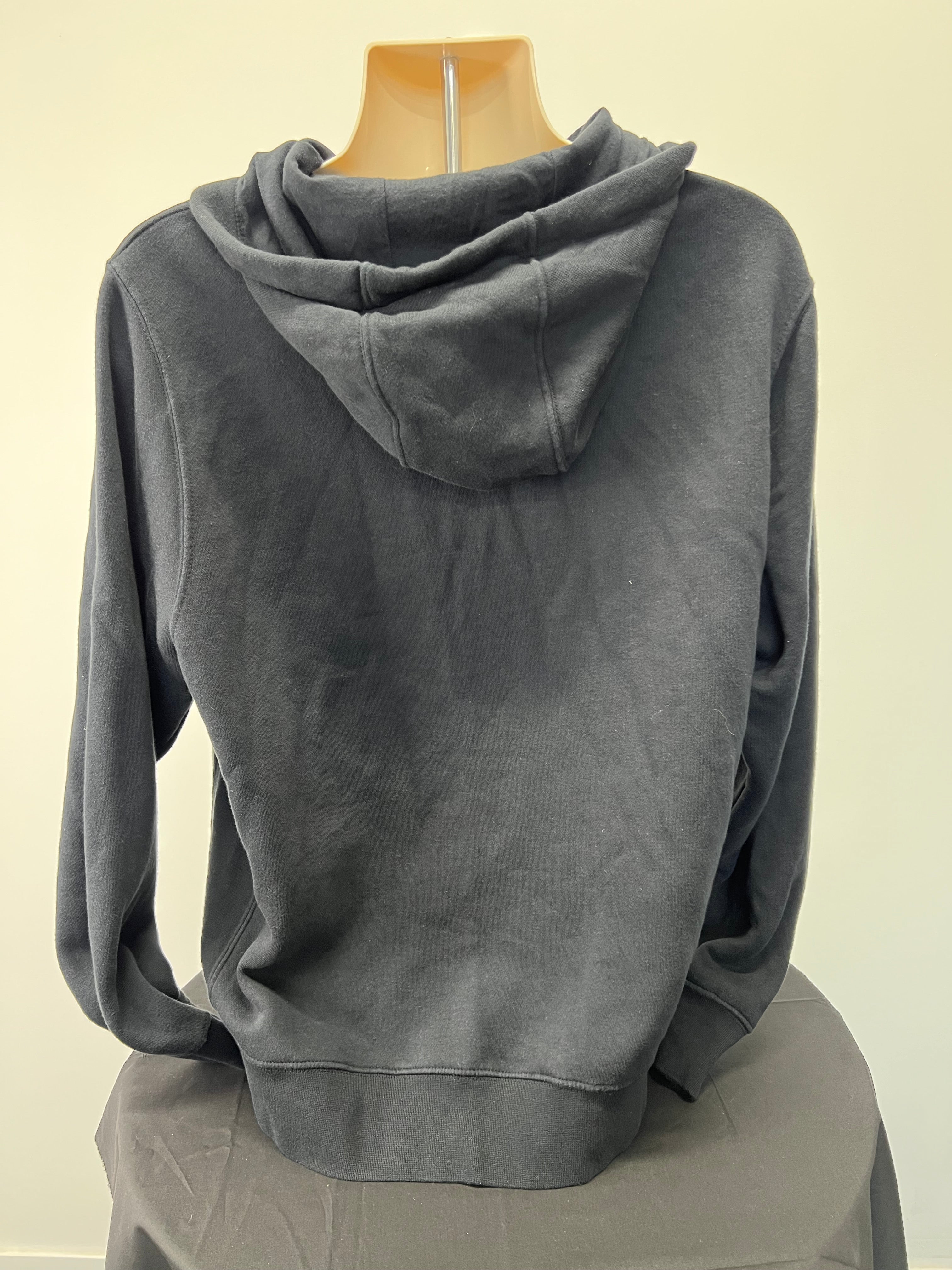 Back view of black Nike zip-up hoodie showing plain design with attached hood