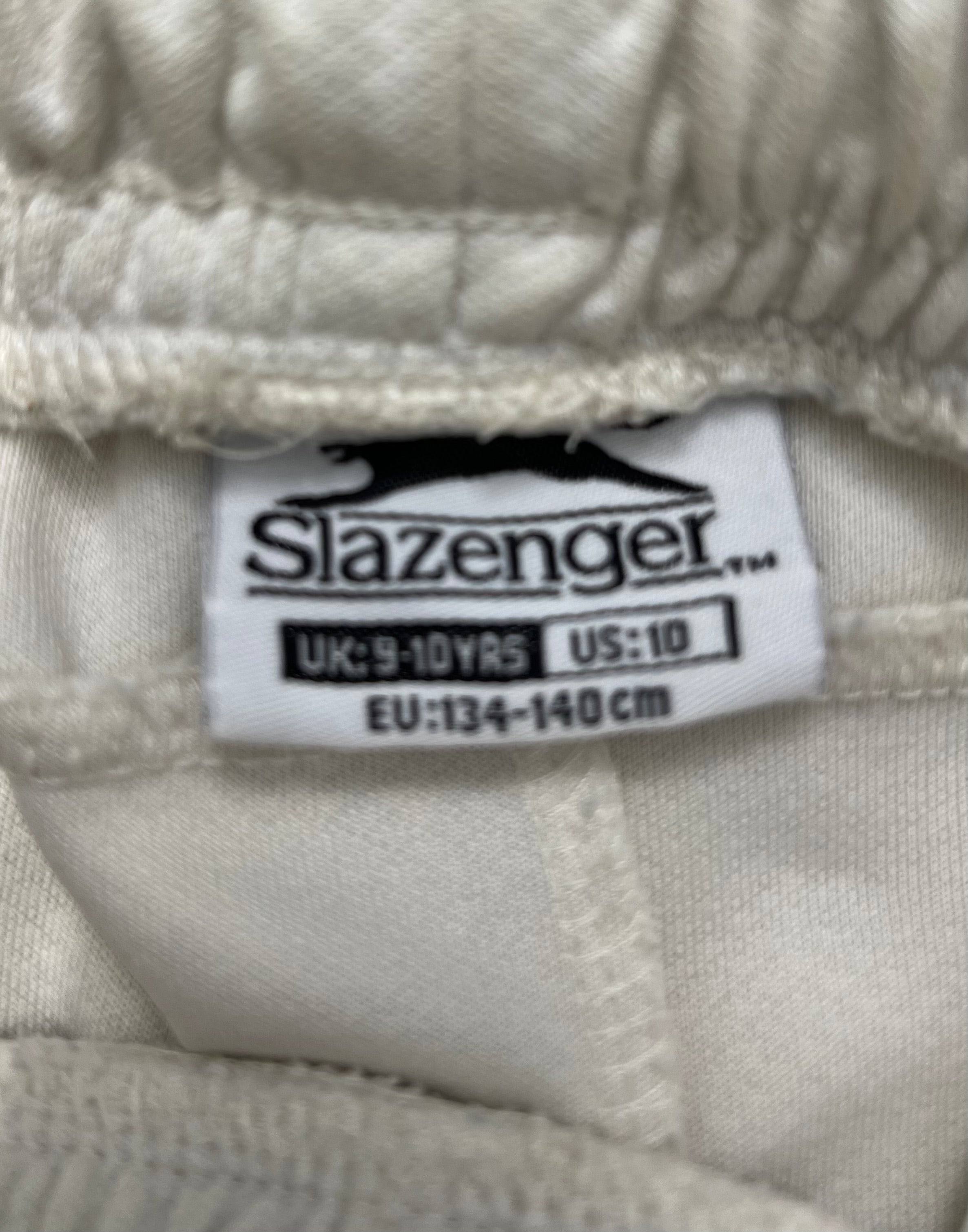 Close-up of Slazenger size label showing UK 9-10 years on cricket trousers