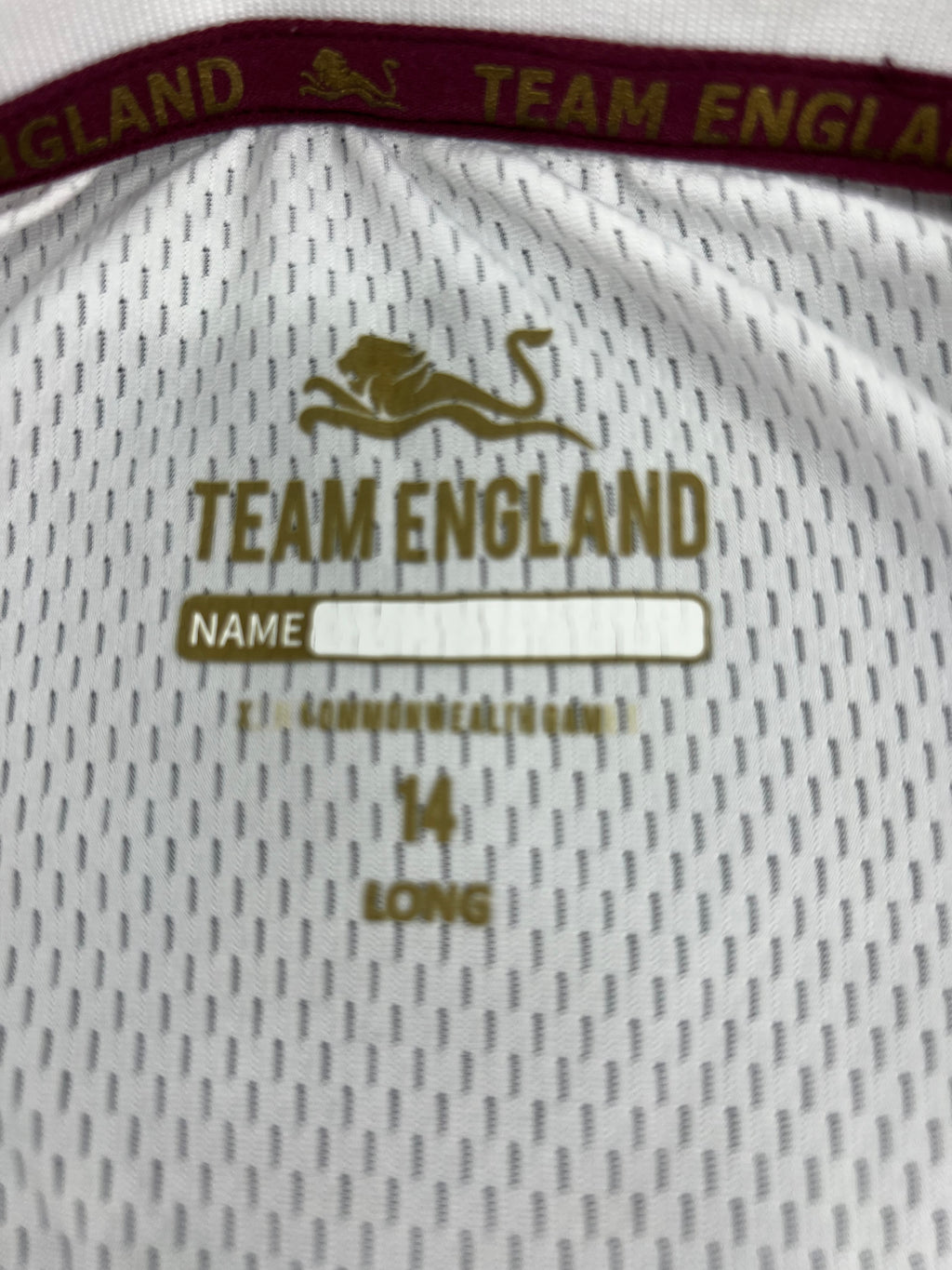 Close-up of internal label showing Team England branding and size 14 long