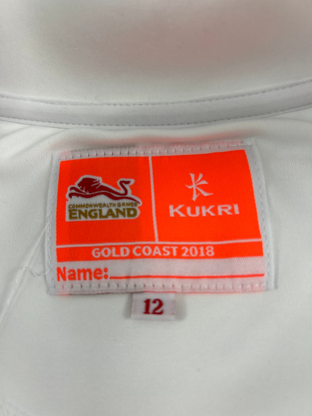 Close-up of label inside Team England women's top showing Commonwealth Games Gold Coast 2018 and Kukri branding
