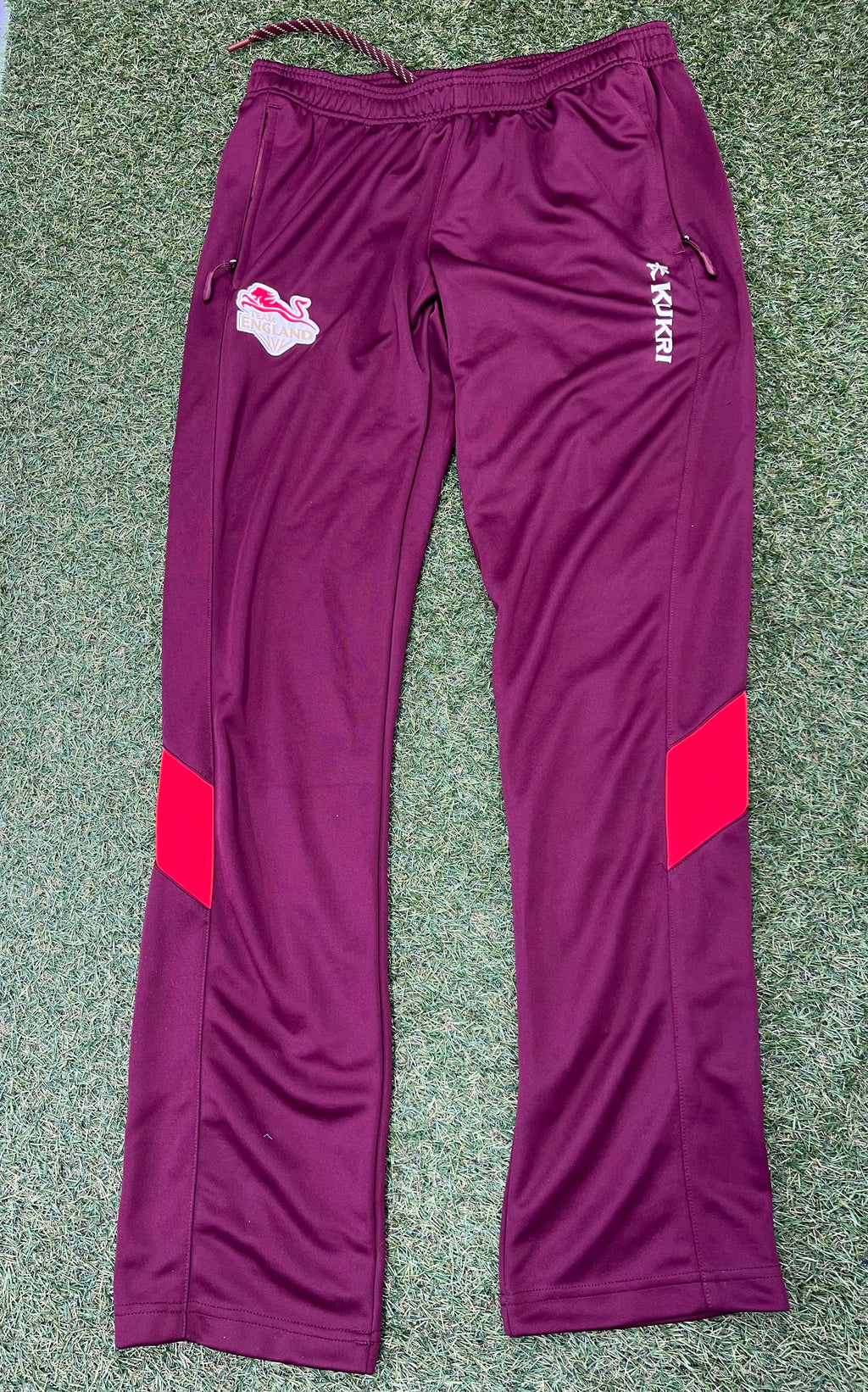 Maroon Team England women's tracksuit bottoms by Kukri with red leg panels and zipped pockets