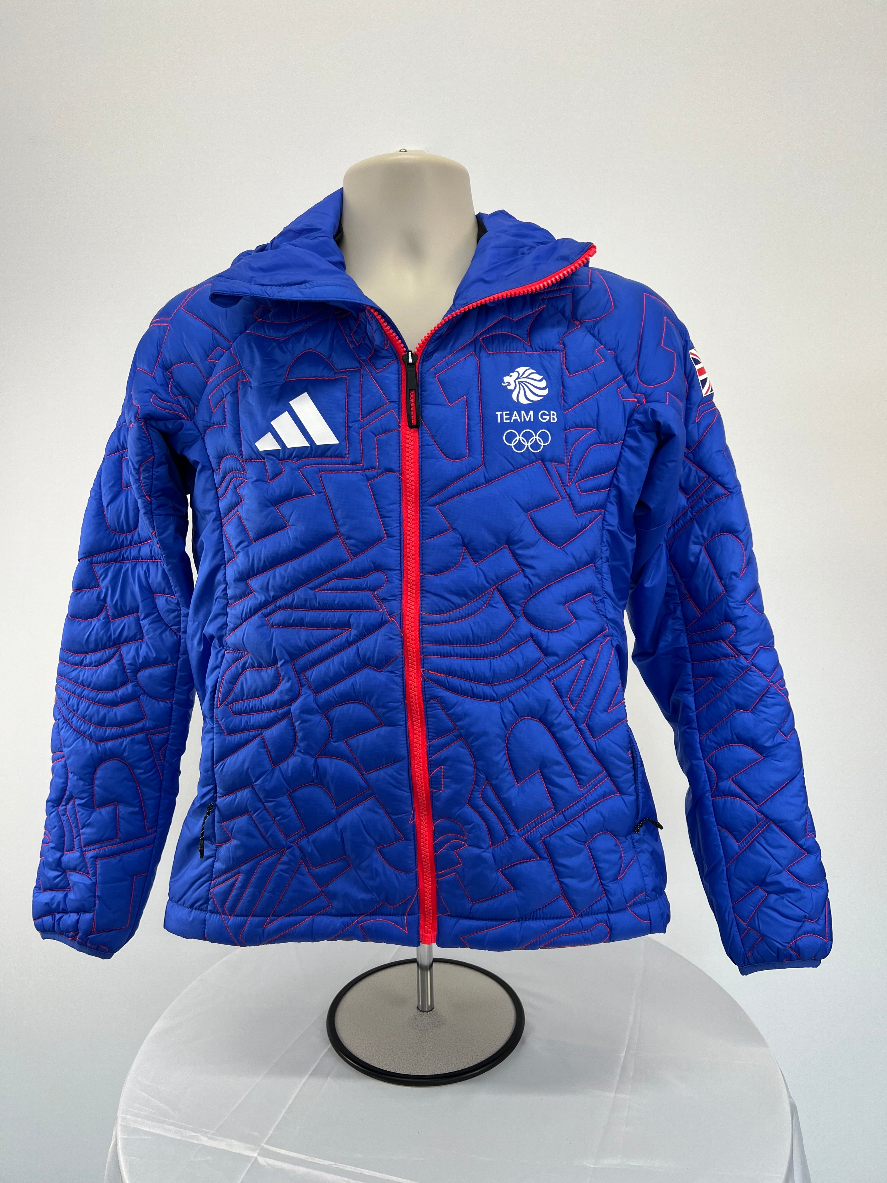 Front view of women's blue Team GB puffer jacket with red zipper and front logos