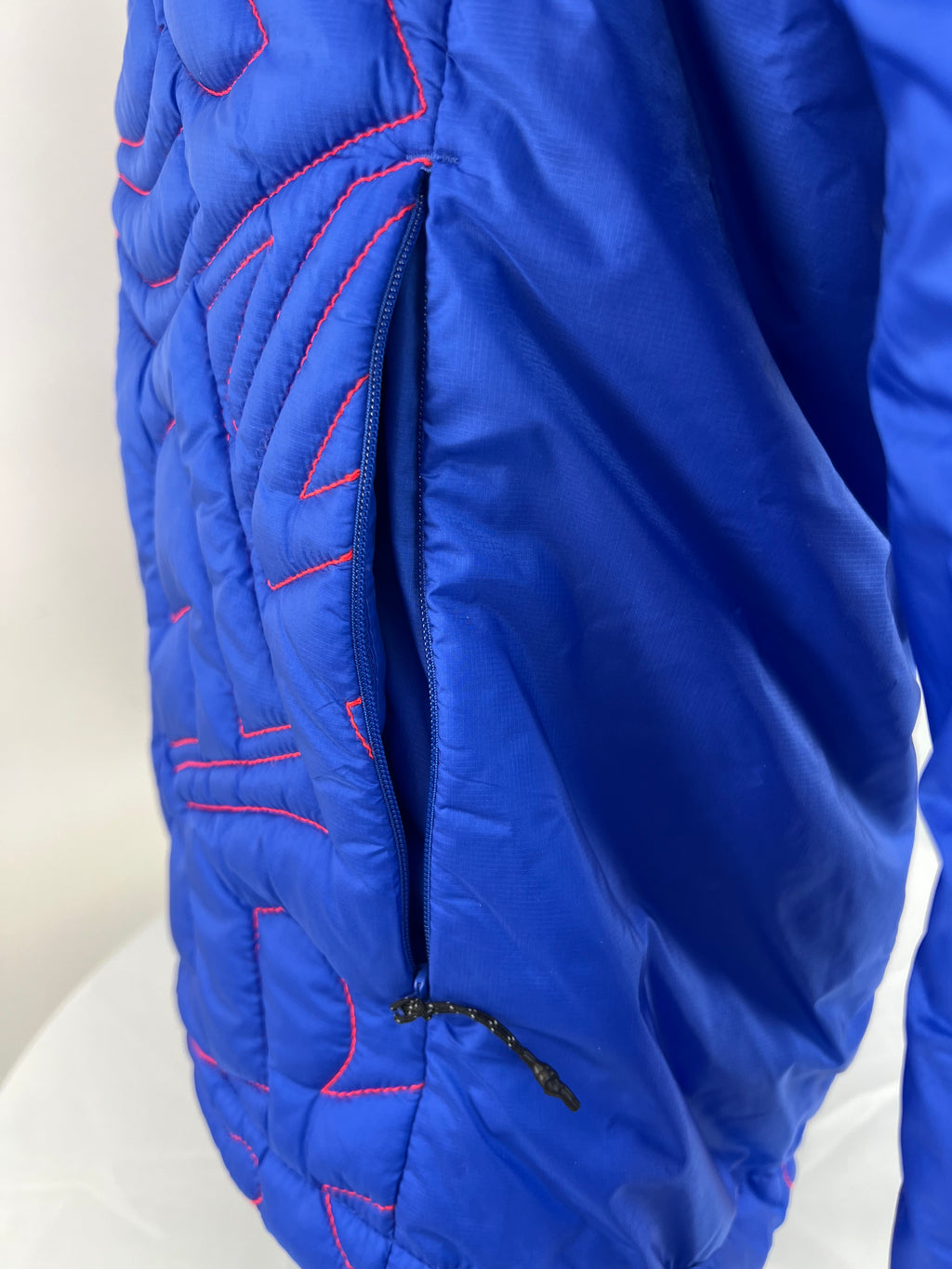 Detailed shot of zippered side pocket on blue Team GB jacket