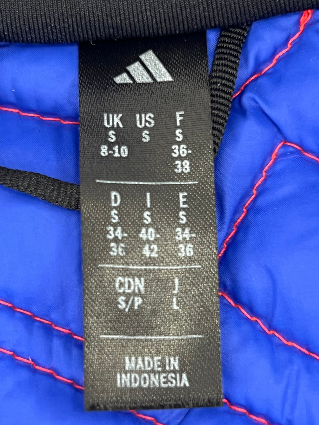 Size label showing Adidas branding, UK size S, made in Indonesia