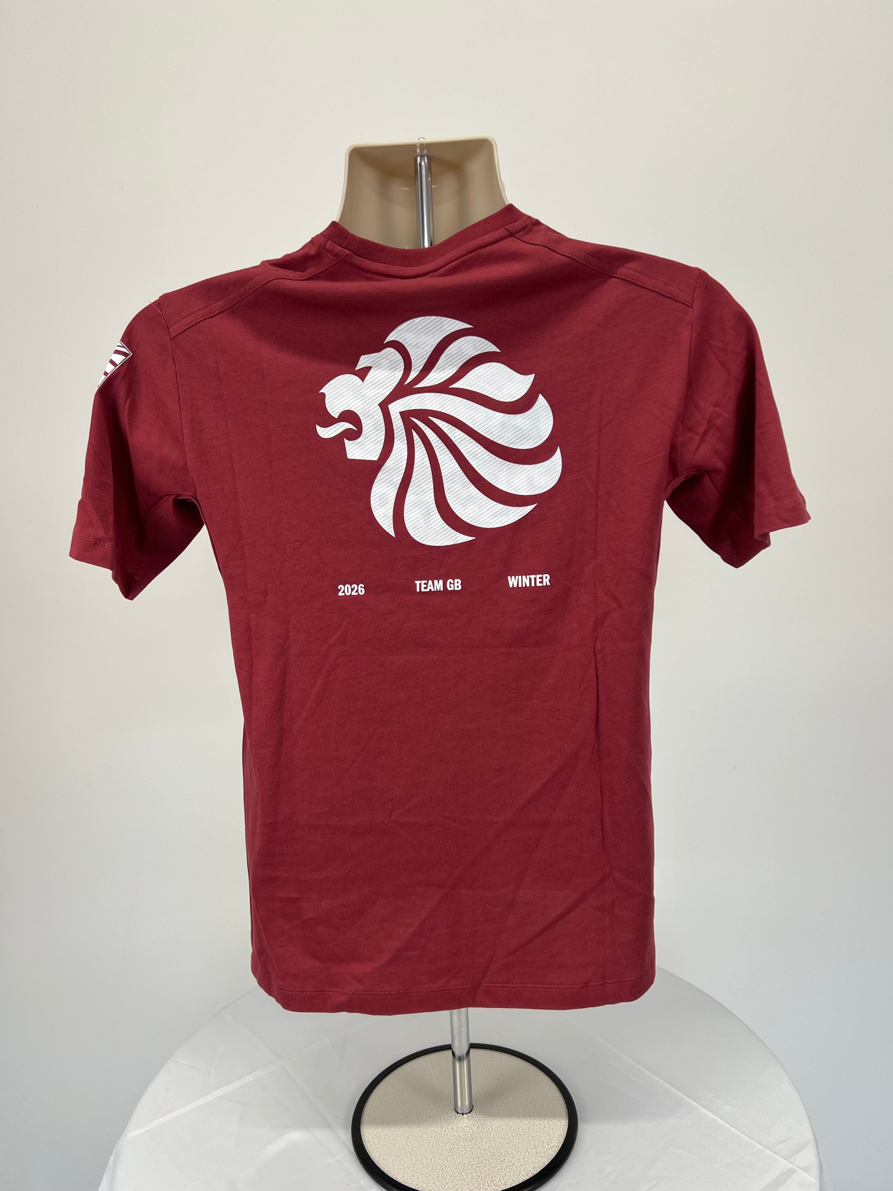 Back view of Adidas Team GB burgundy t-shirt with large white lion emblem and text 2026 Team GB Winter