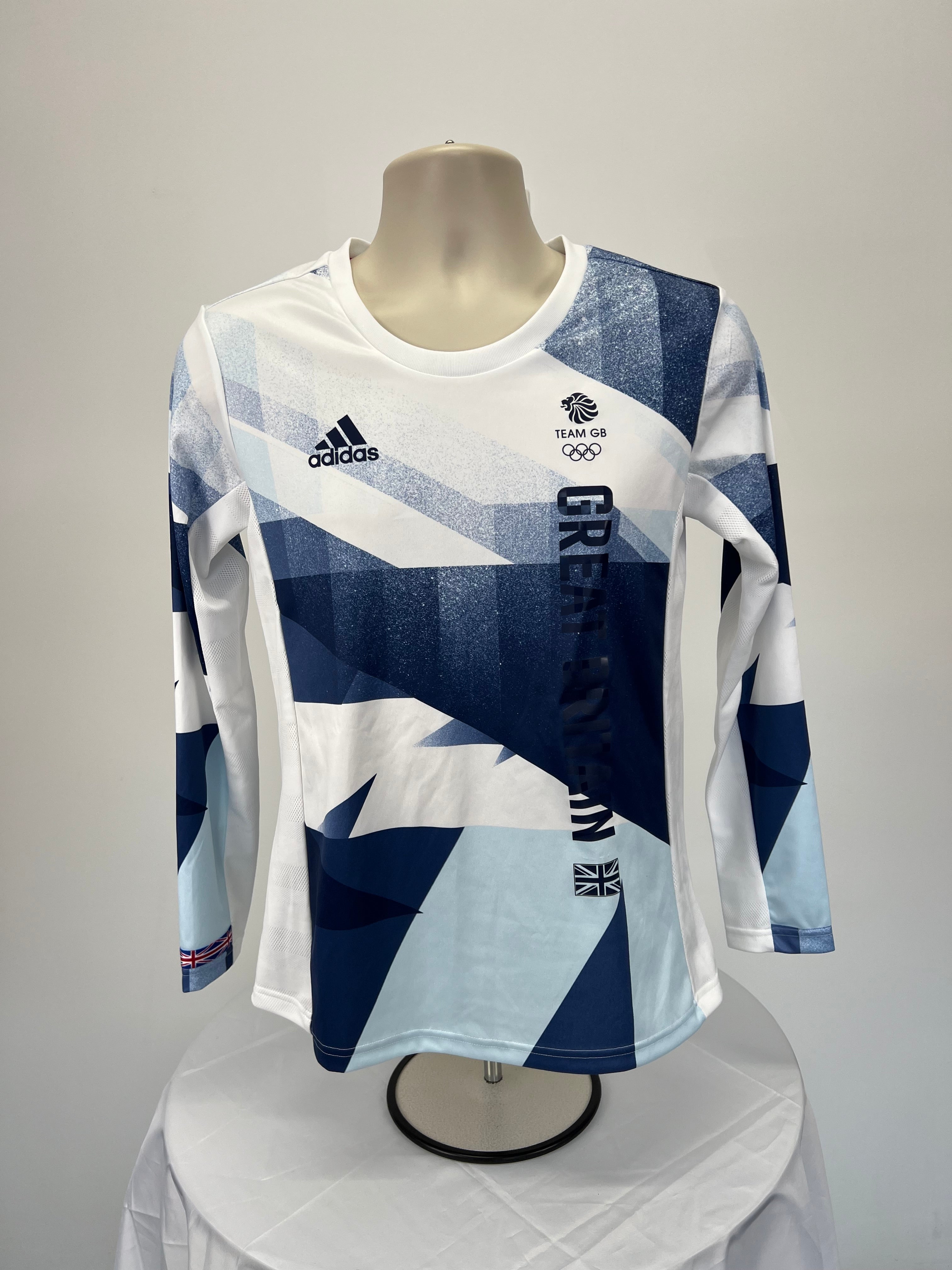 Front view of women’s adidas Team GB long sleeve top in blue and white geometric design with logos