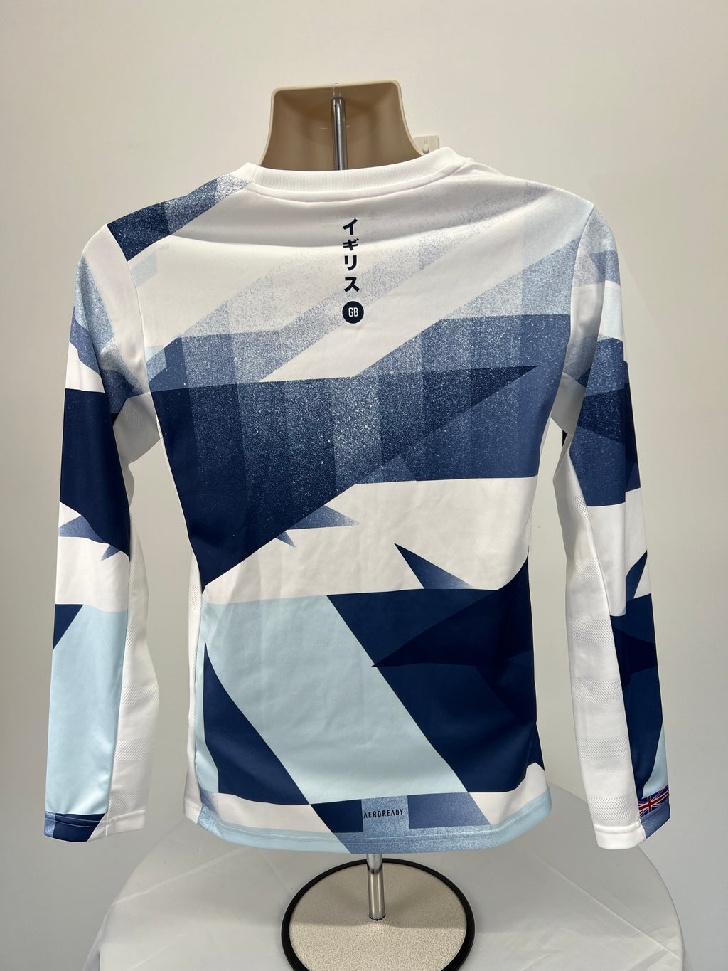 Back view of women’s adidas Team GB long sleeve top showing geometric pattern and Japanese characters