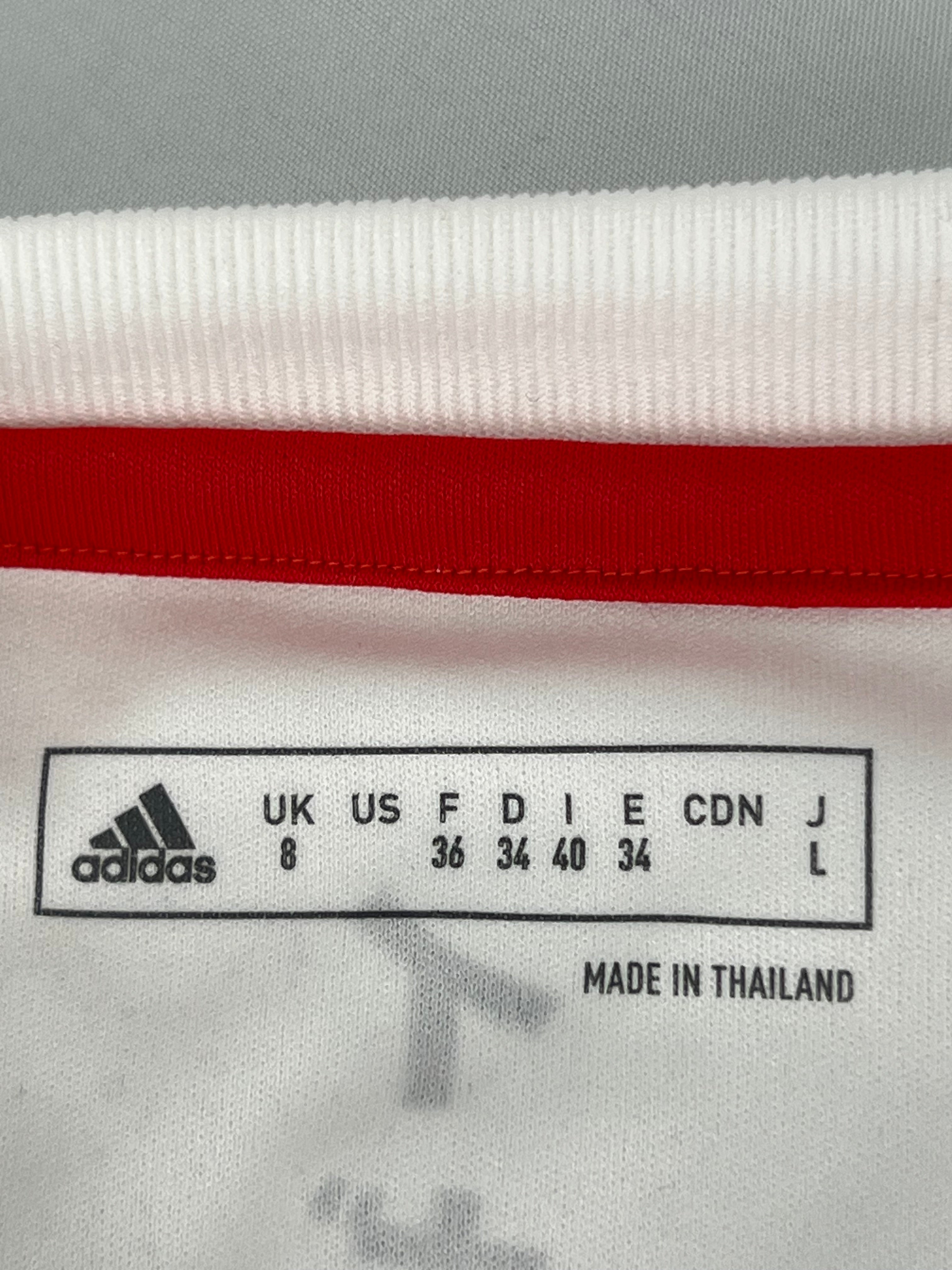 Close-up of size label inside adidas Team GB long sleeve top indicating UK size 8 and made in Thailand
